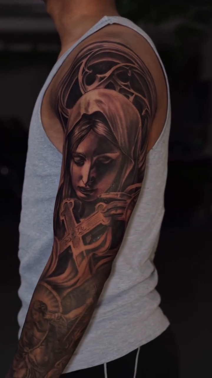 Virgin Mary with cross realism tattoo by Loi Nguyen