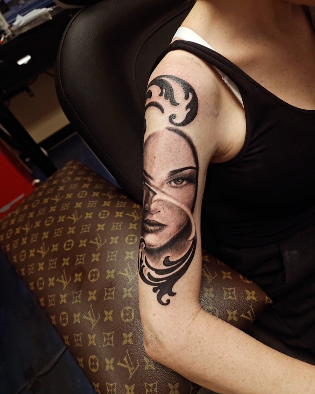 Woman's face realism tattoo on the forearm by Germaine Sherman