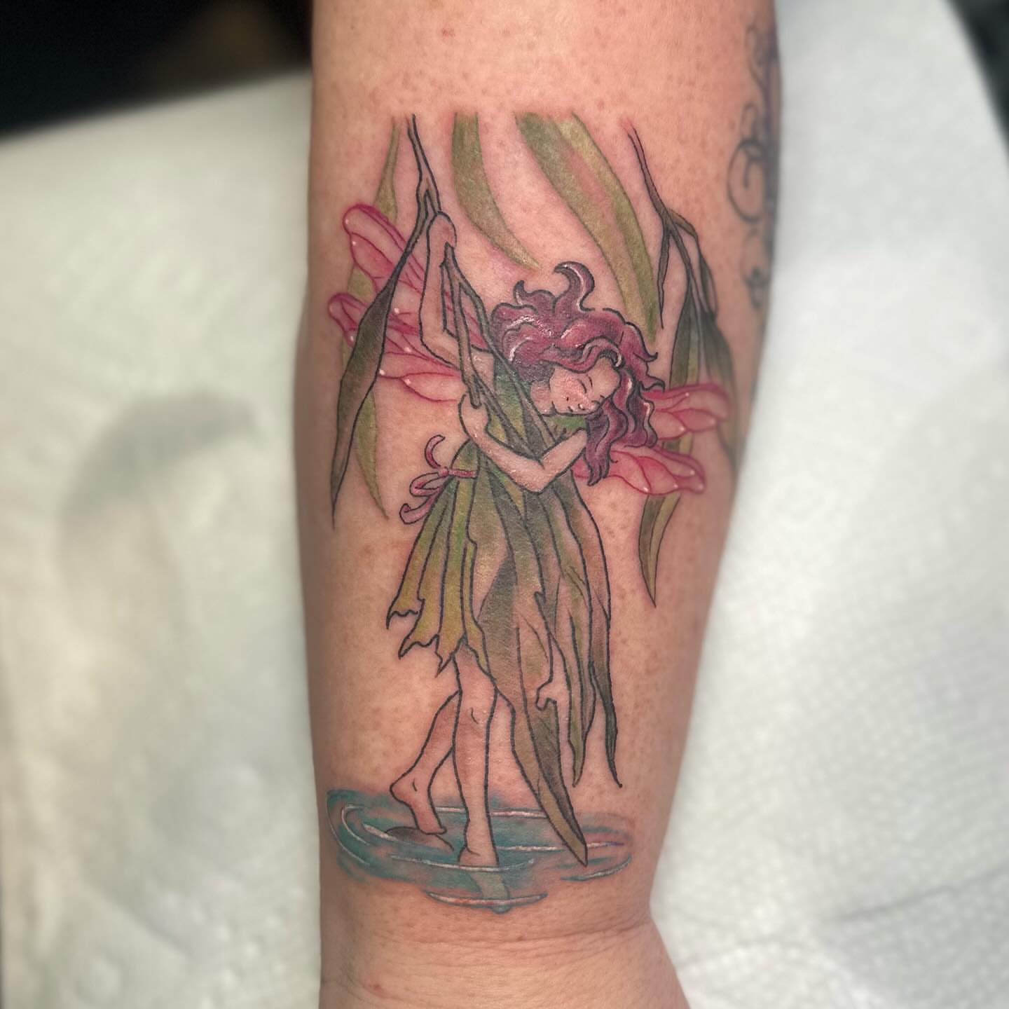 Fairy illustrative tattoo on the forearm by Halle Haas