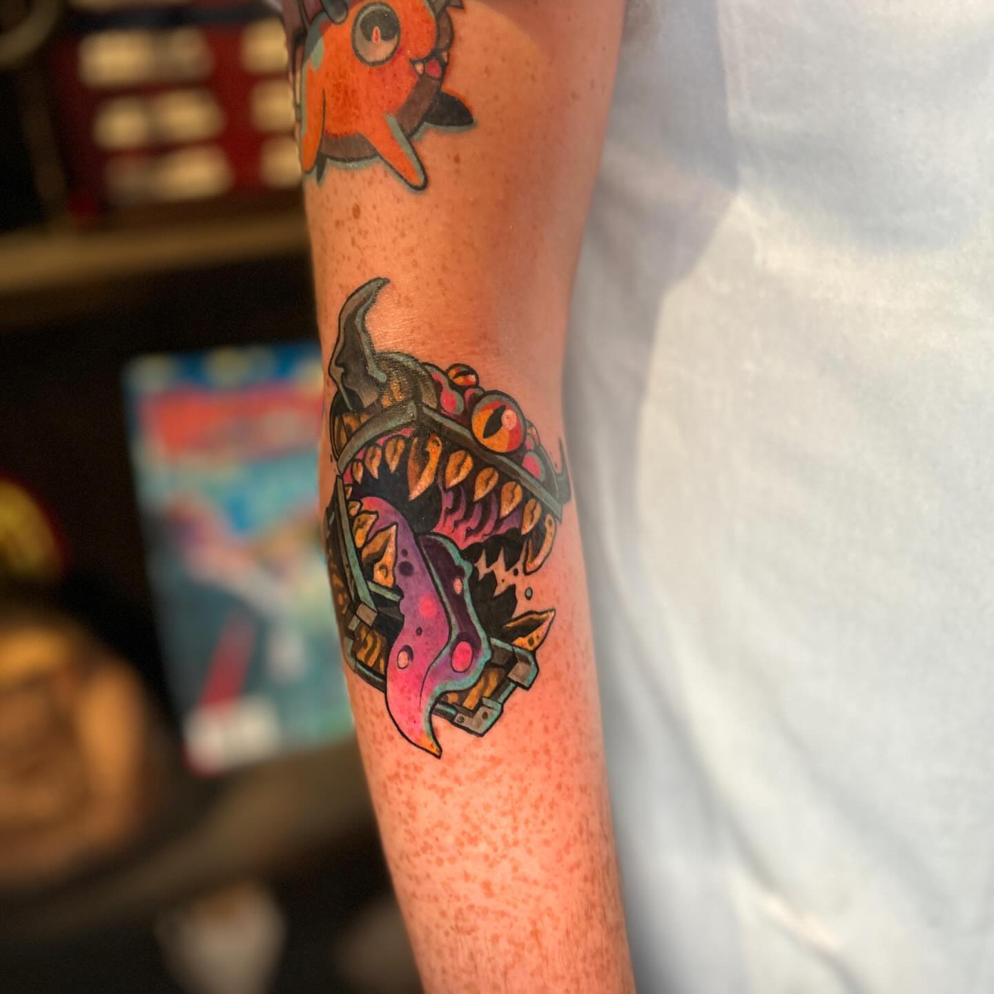 Monster head new school tattoo on the forearm by Rat Girl, Dayton, Ohio