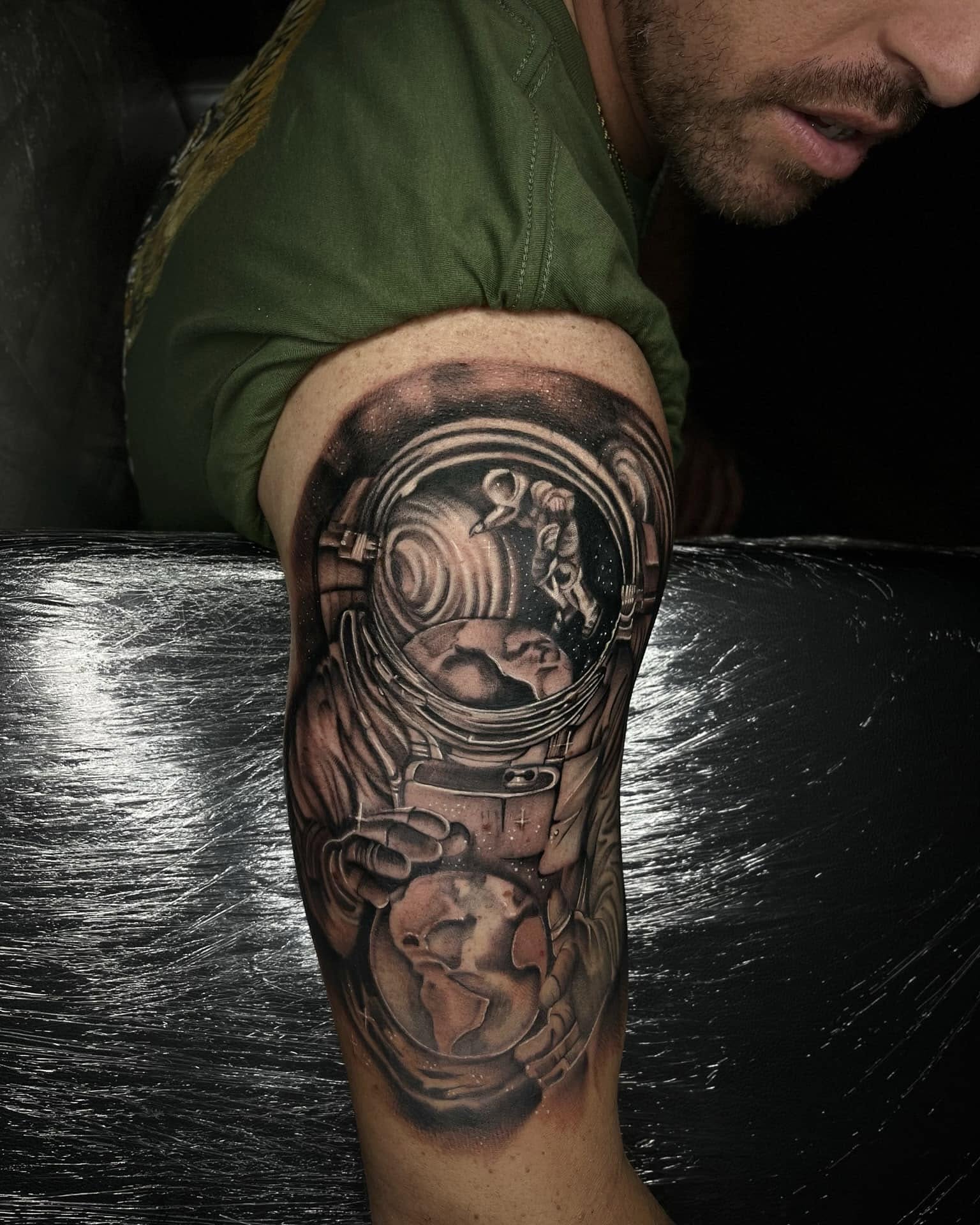 Astronaut with globe realism tattoo on the forearm by Chris_Tatt2_D’Ascenzo