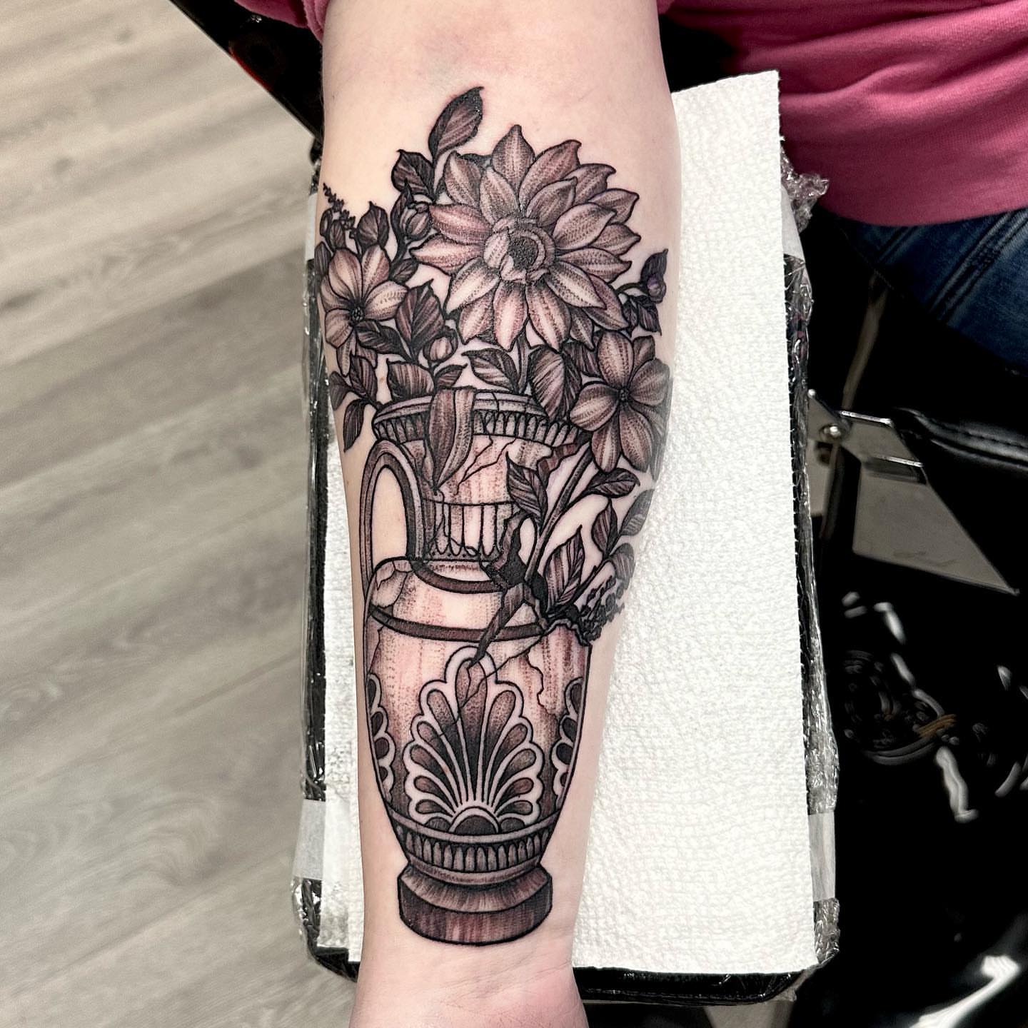 Flower arrangement black and grey tattoo on the forearm by Amber Joy (AJ)