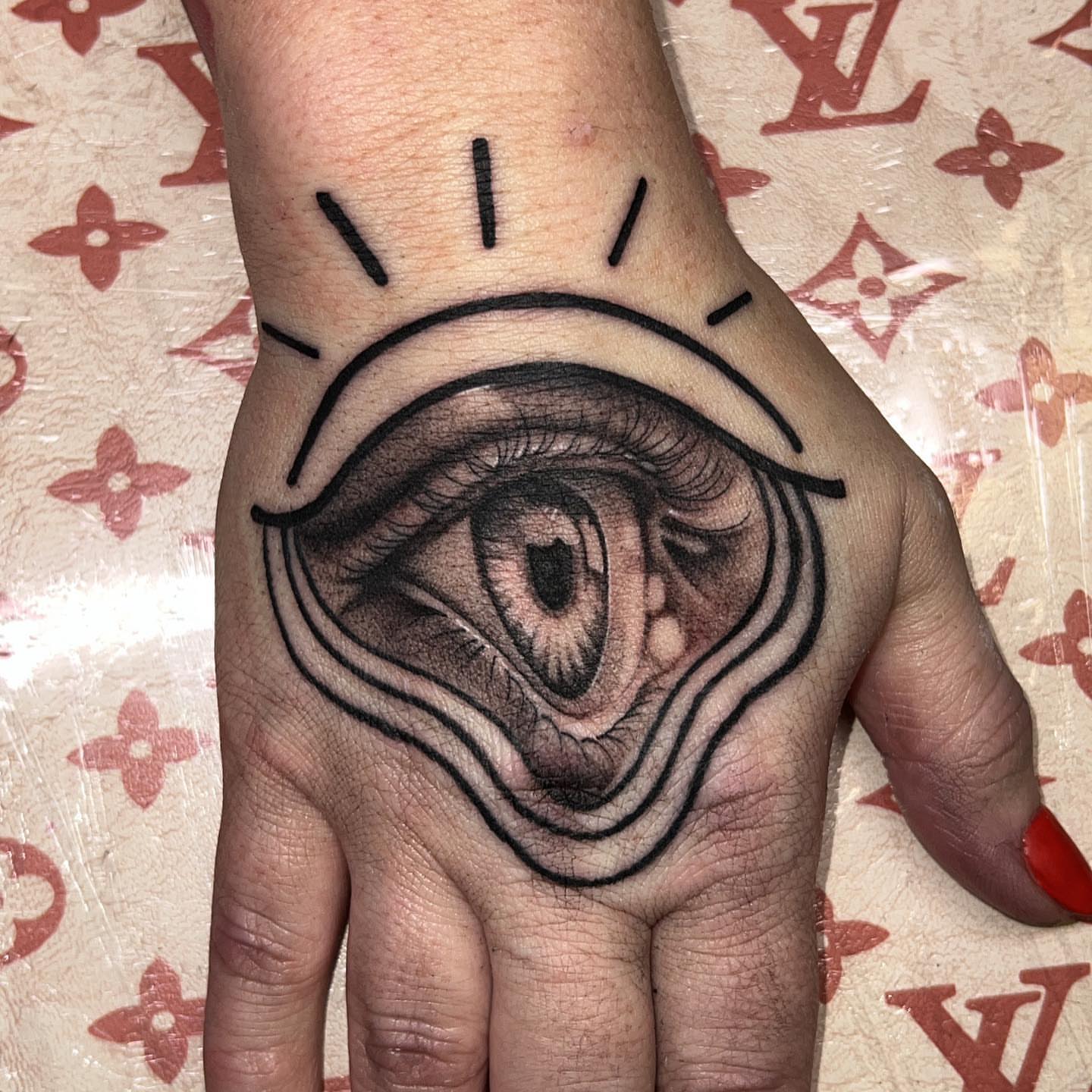 Eye black and grey tattoo on the hand by Ebony Robinson, Austintown, Ohio