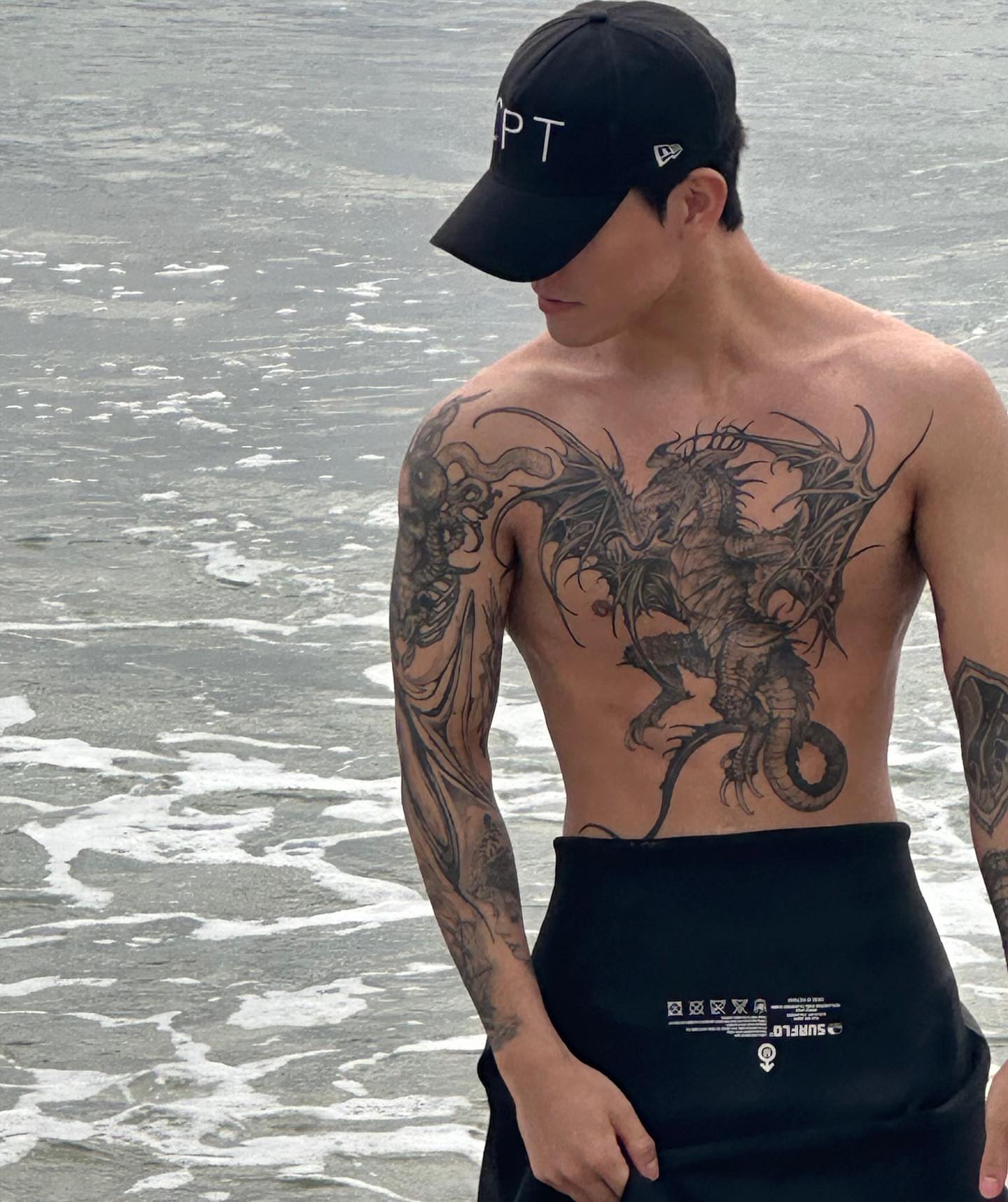 Dragon black and grey tattoo on the chest by 우레