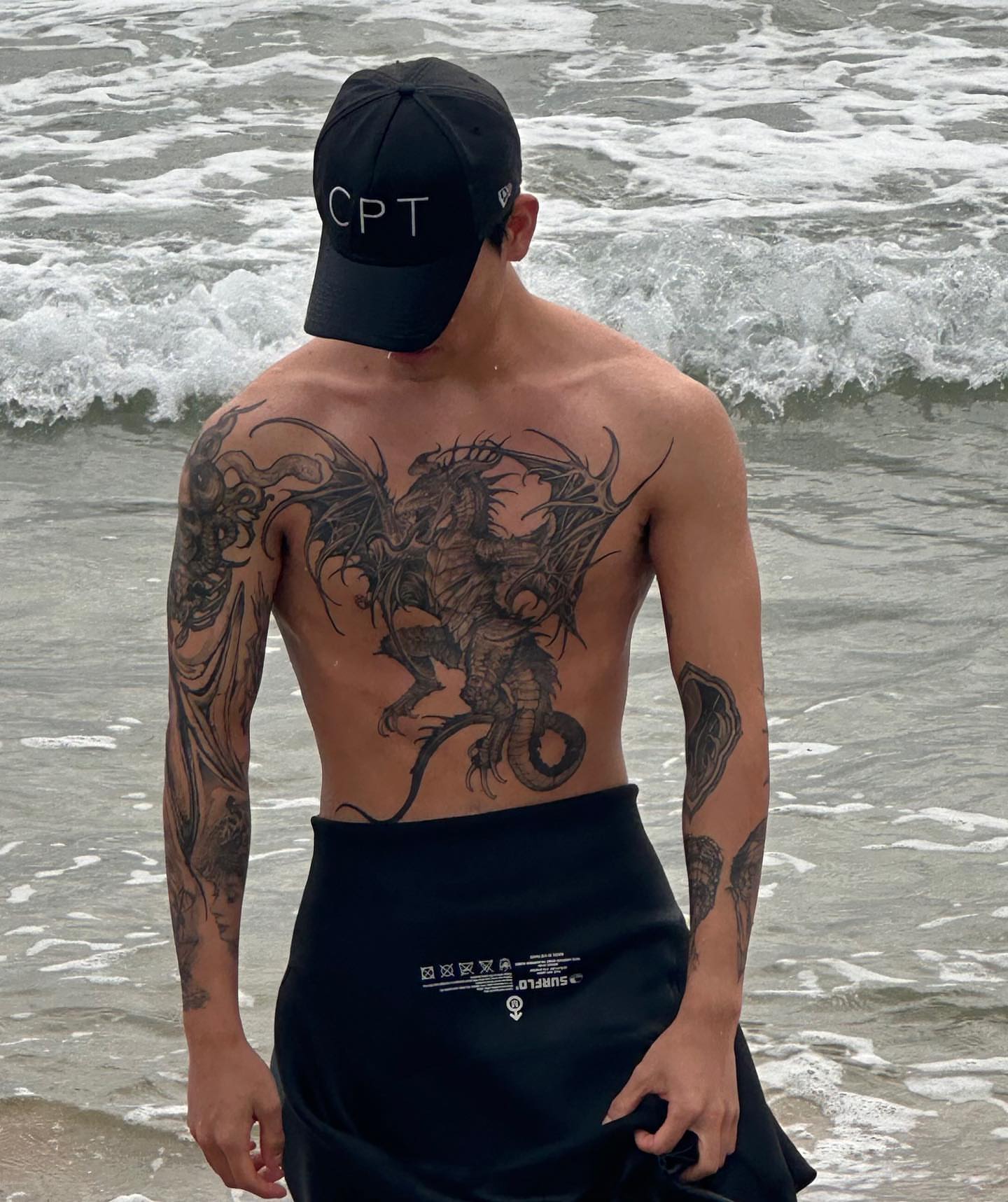 Dragon black and grey tattoo on the chest by 우레