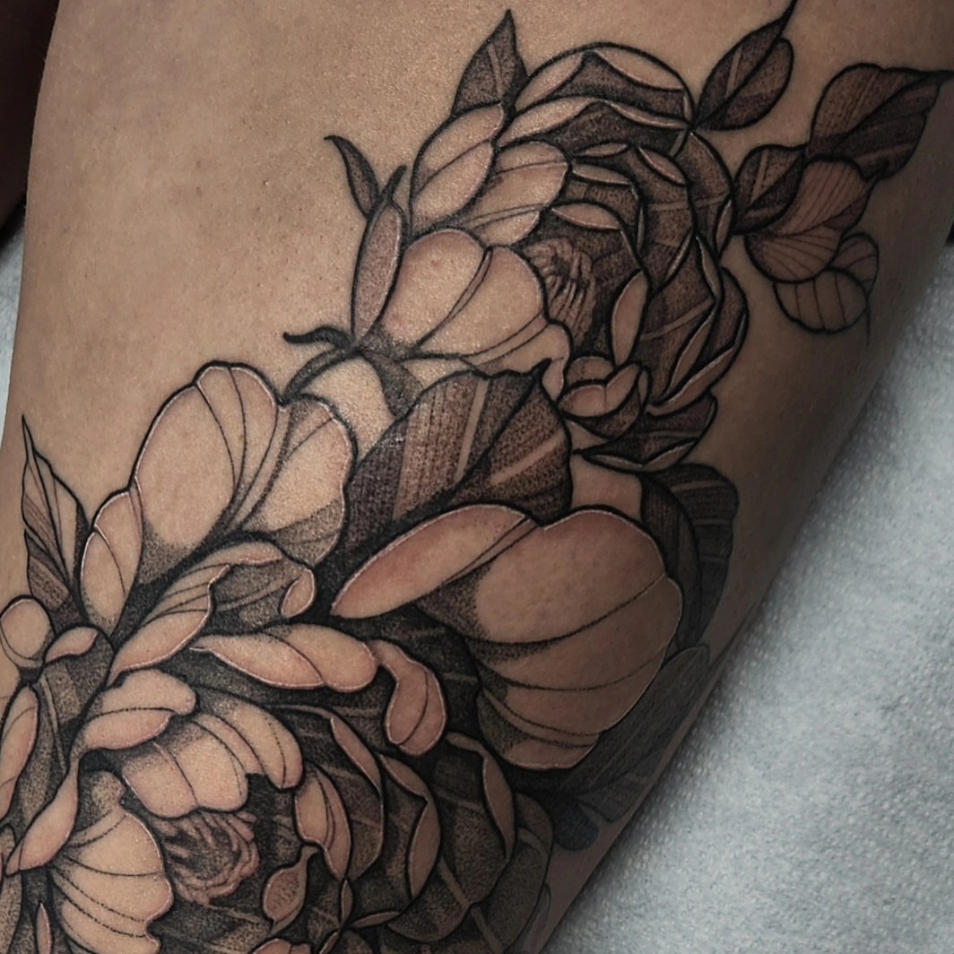 Peony flowers black and grey tattoo on the thigh by Kyle Joseph [tattoo artist]