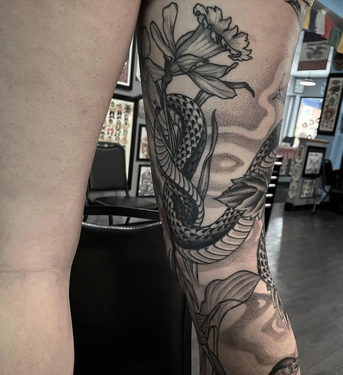 Snake and peony dotwork tattoo on the forearm by Lauren Vandevier