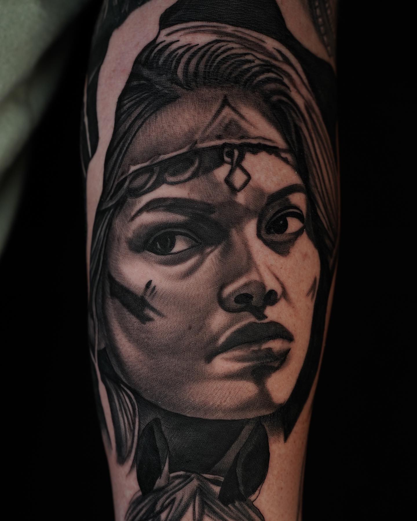 Woman's face realism tattoo on the forearm by Travis