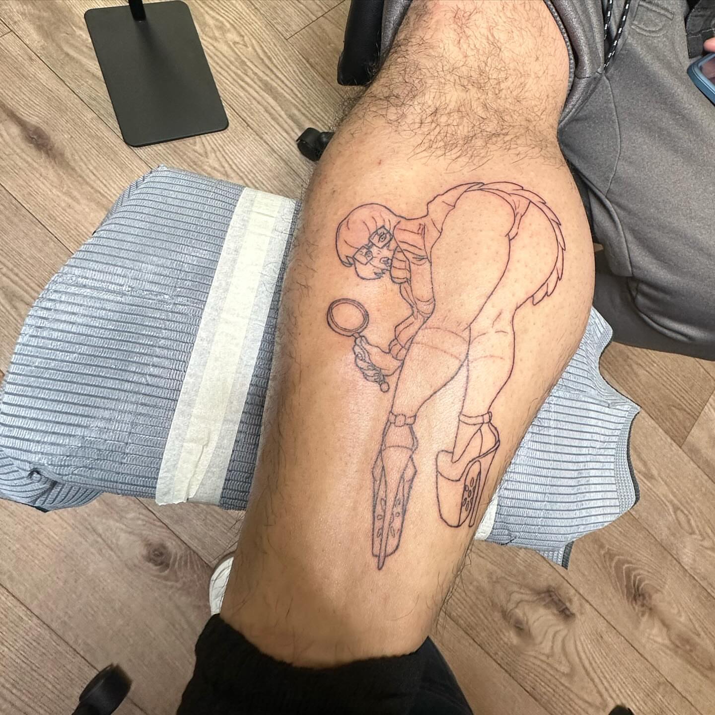 Diver black and grey tattoo on the thigh by Roxanne Ochoa