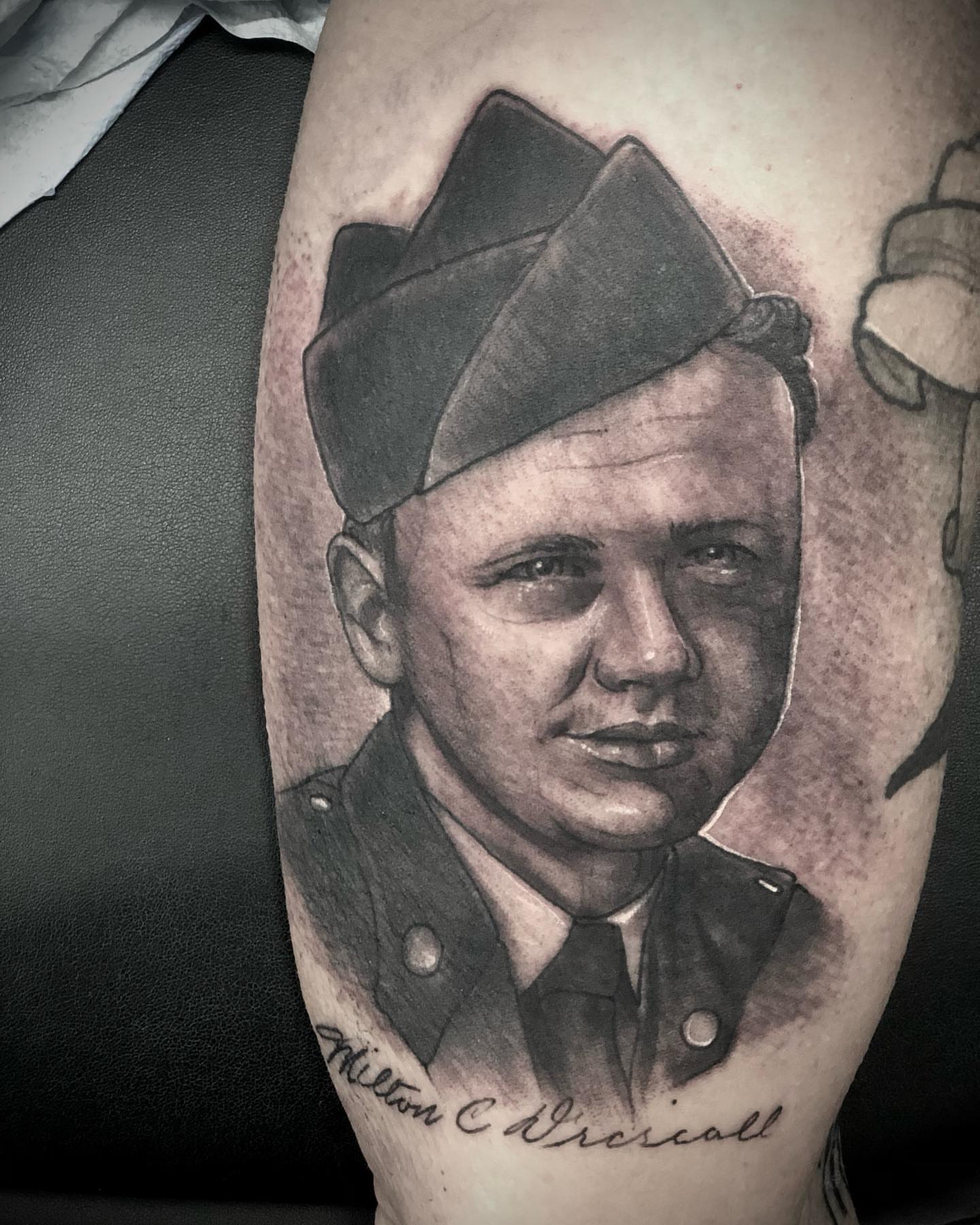 Portrait of soldier realism tattoo on the forearm by Alec Bauer