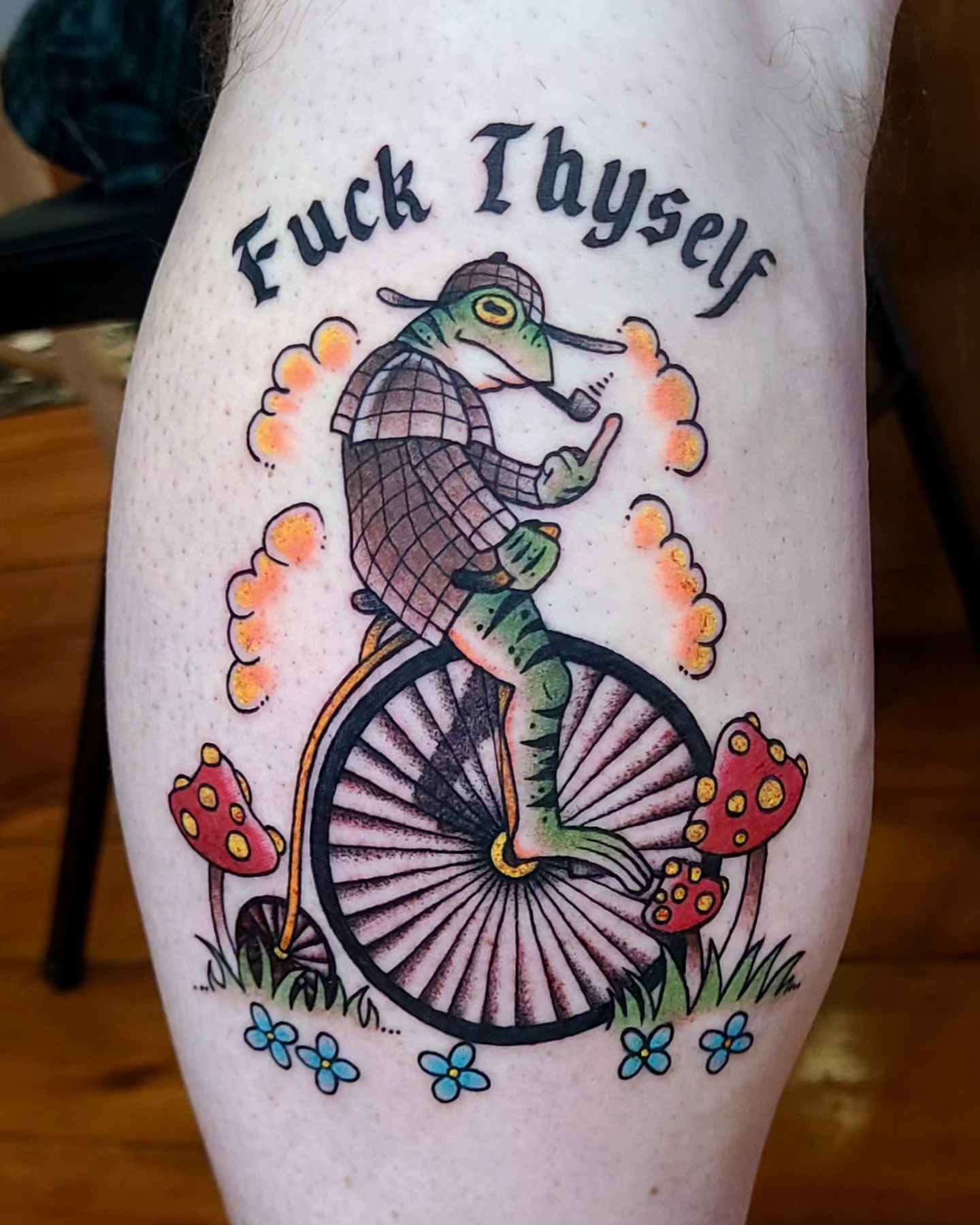 Fish riding bicycle American traditional tattoo on the thigh by Chloe🌿Tattoos