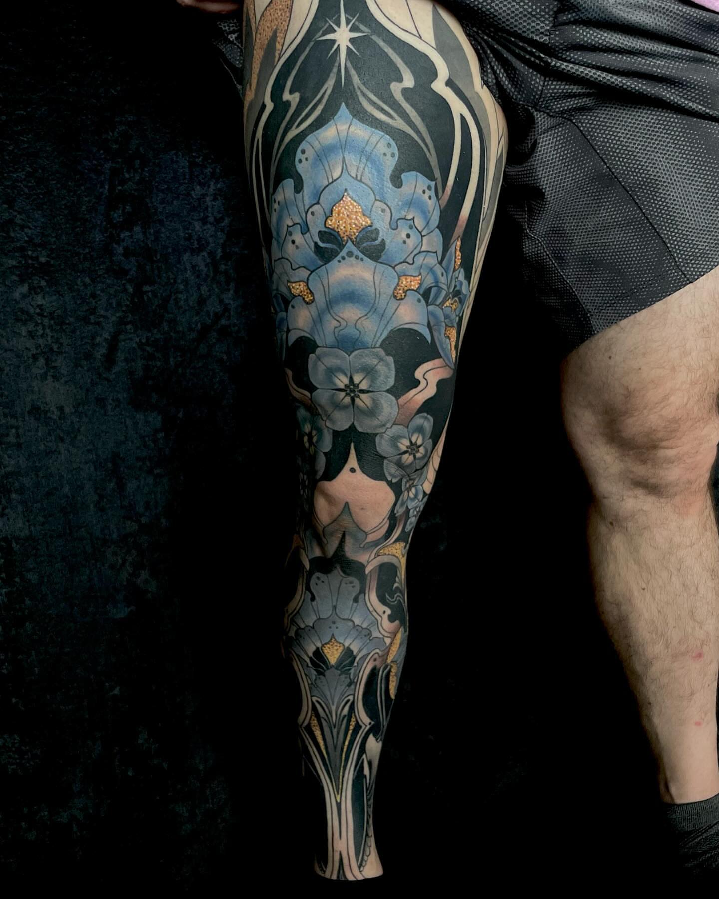 Floral pattern ornamental tattoo on the calf by Laura Babsie