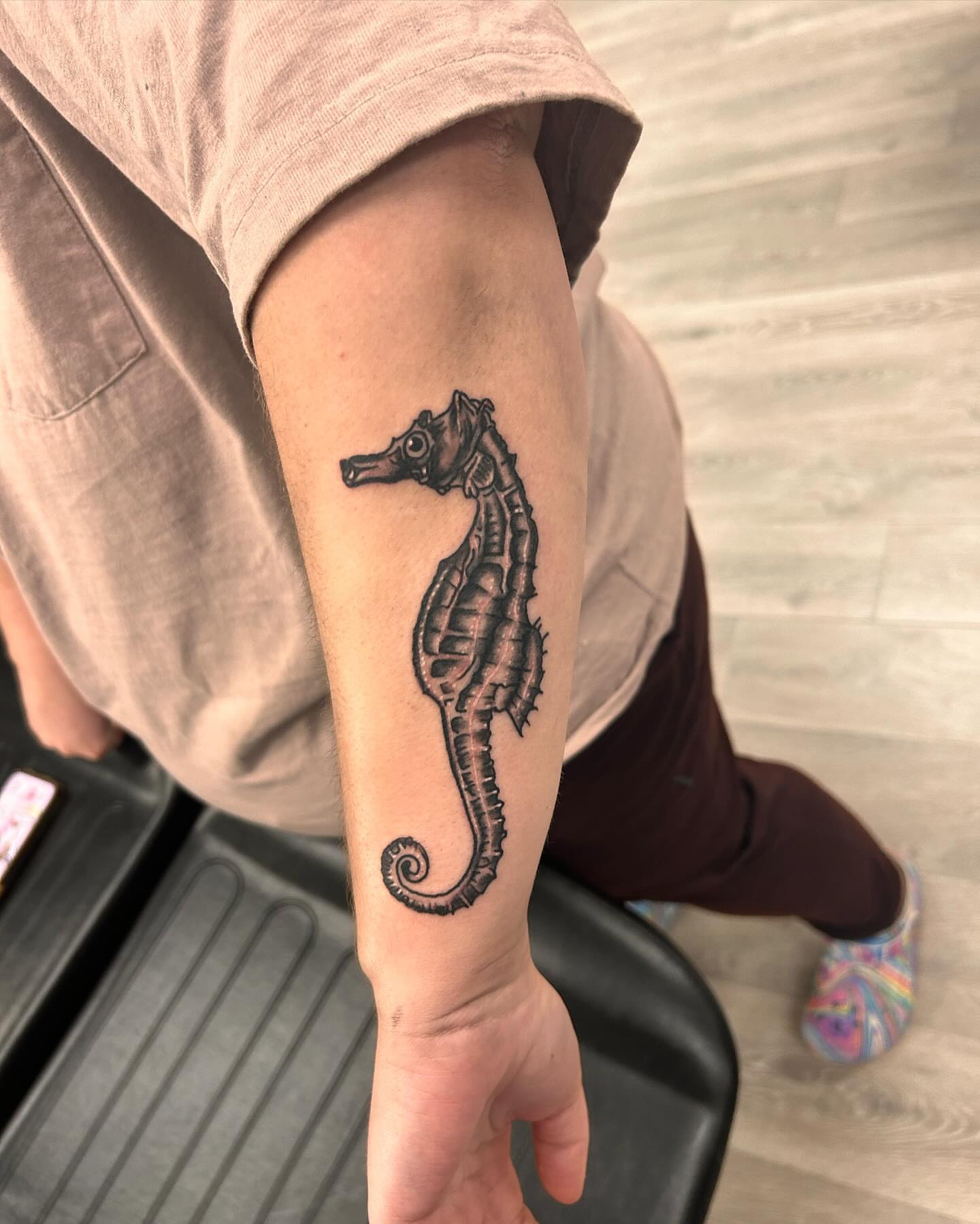 Seahorse black and grey tattoo on the forearm by Alyssa Turner
