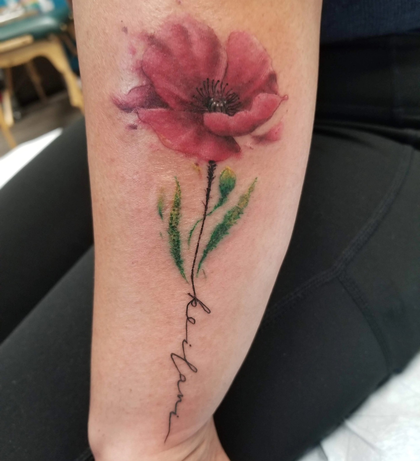 Poppy flower watercolor tattoo on the forearm by Martin Colonna