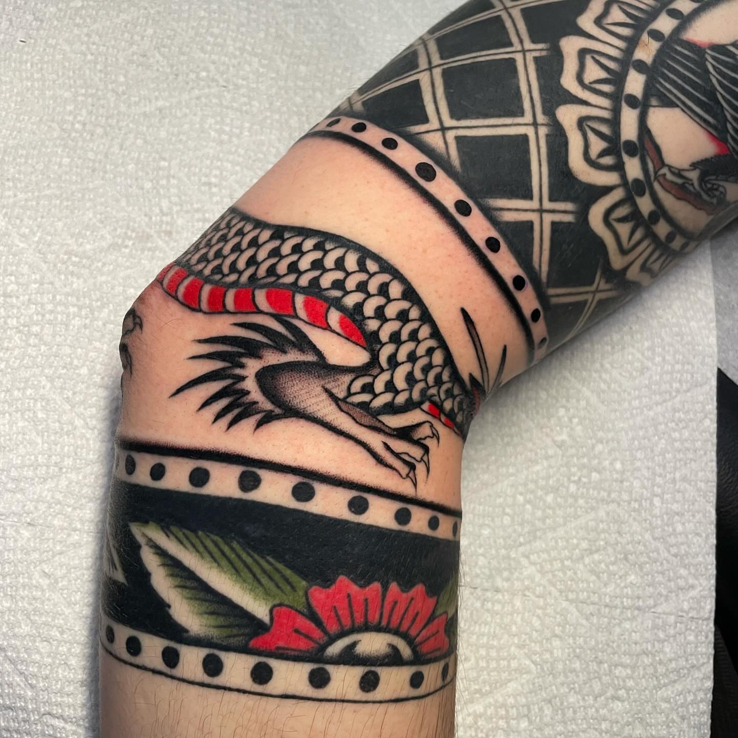 Dragon American traditional tattoo on the forearm by Toulouse Noble, Portland, Oregon