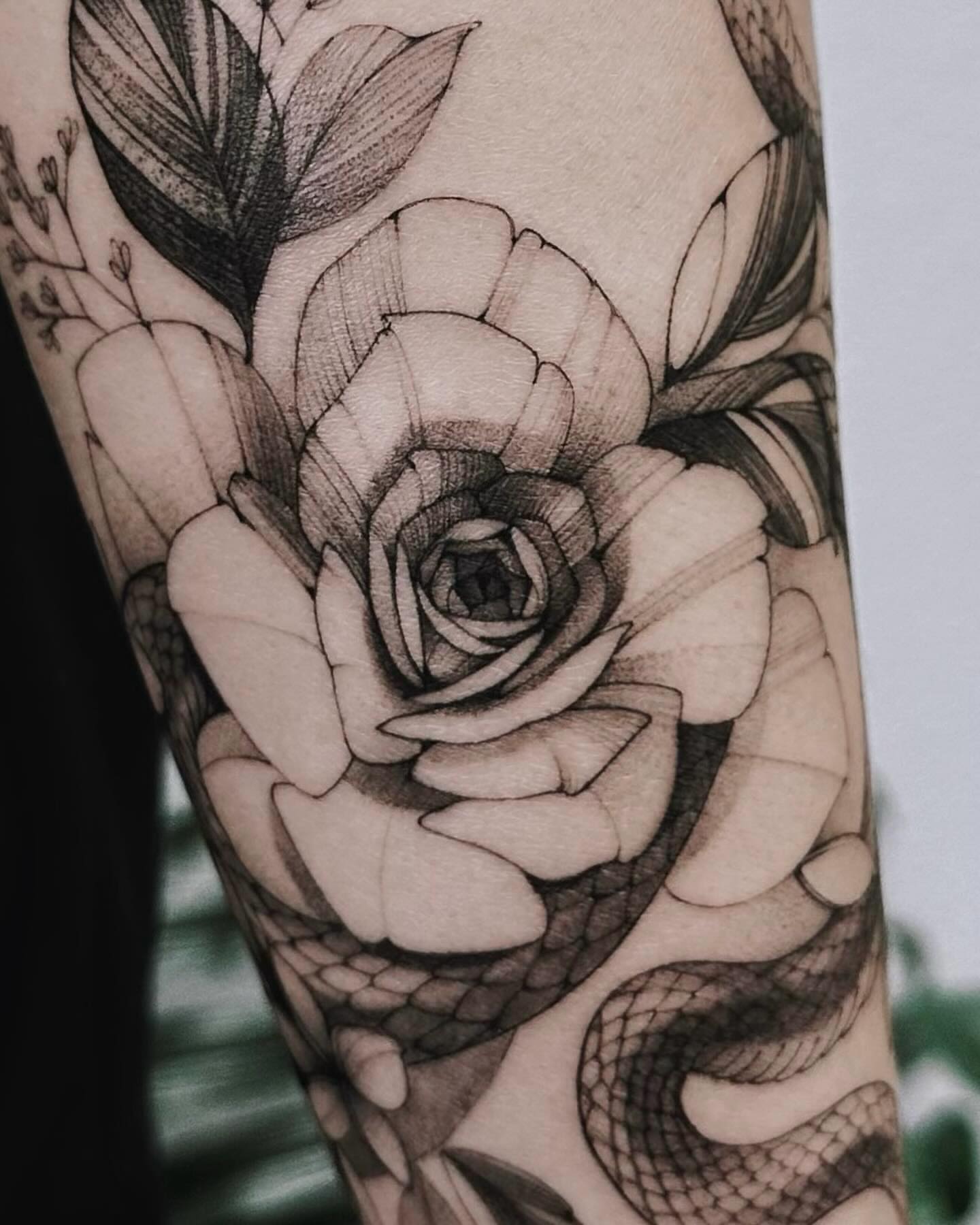 Rose realism tattoo on the forearm by Angel