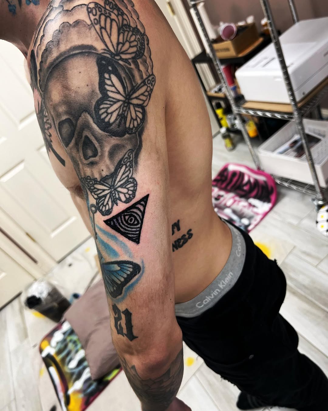 Skull and butterflies realism tattoo on the forearm by Silky Inks NJ 201, North Haledon, New Jersey