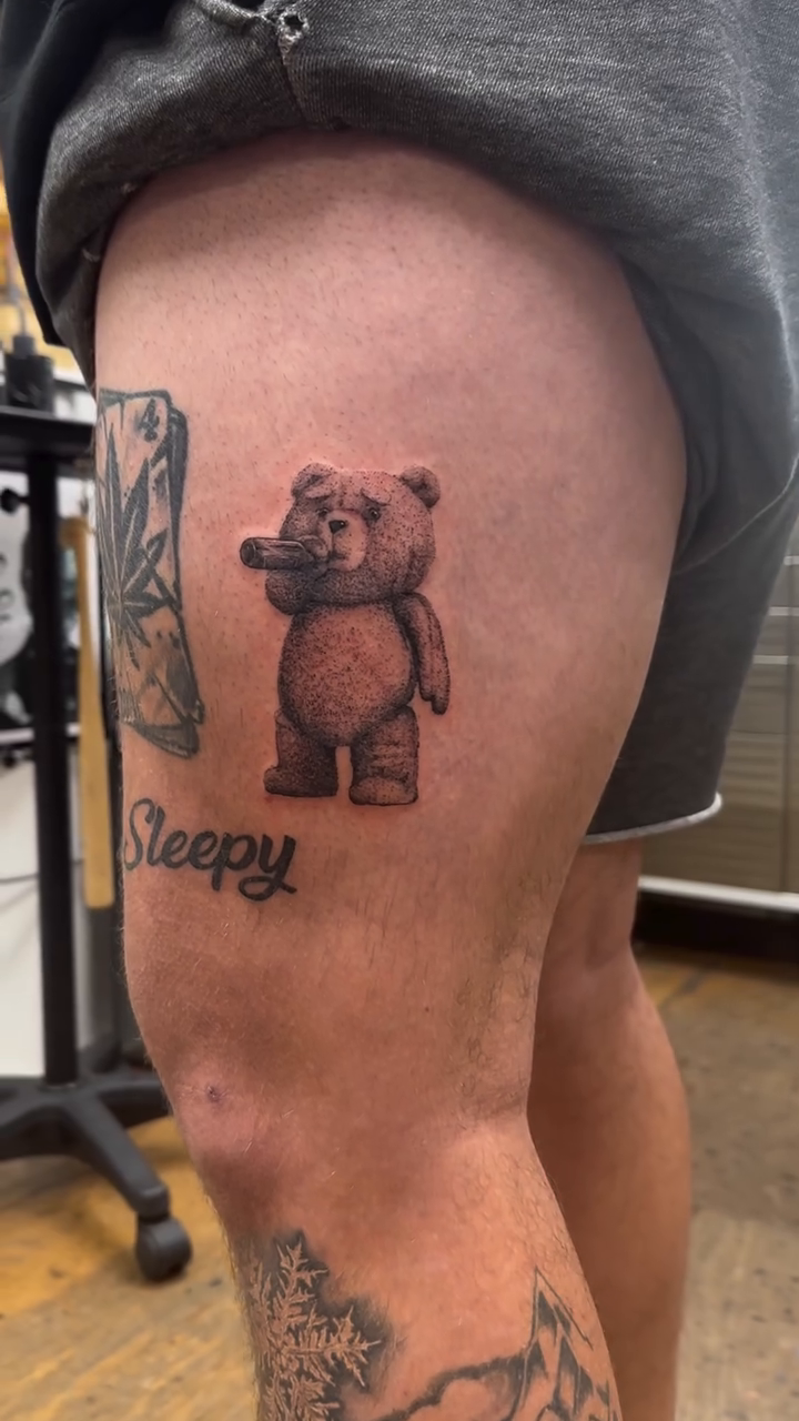 Teddy bear smoking realism tattoo by Arielle Deatherage