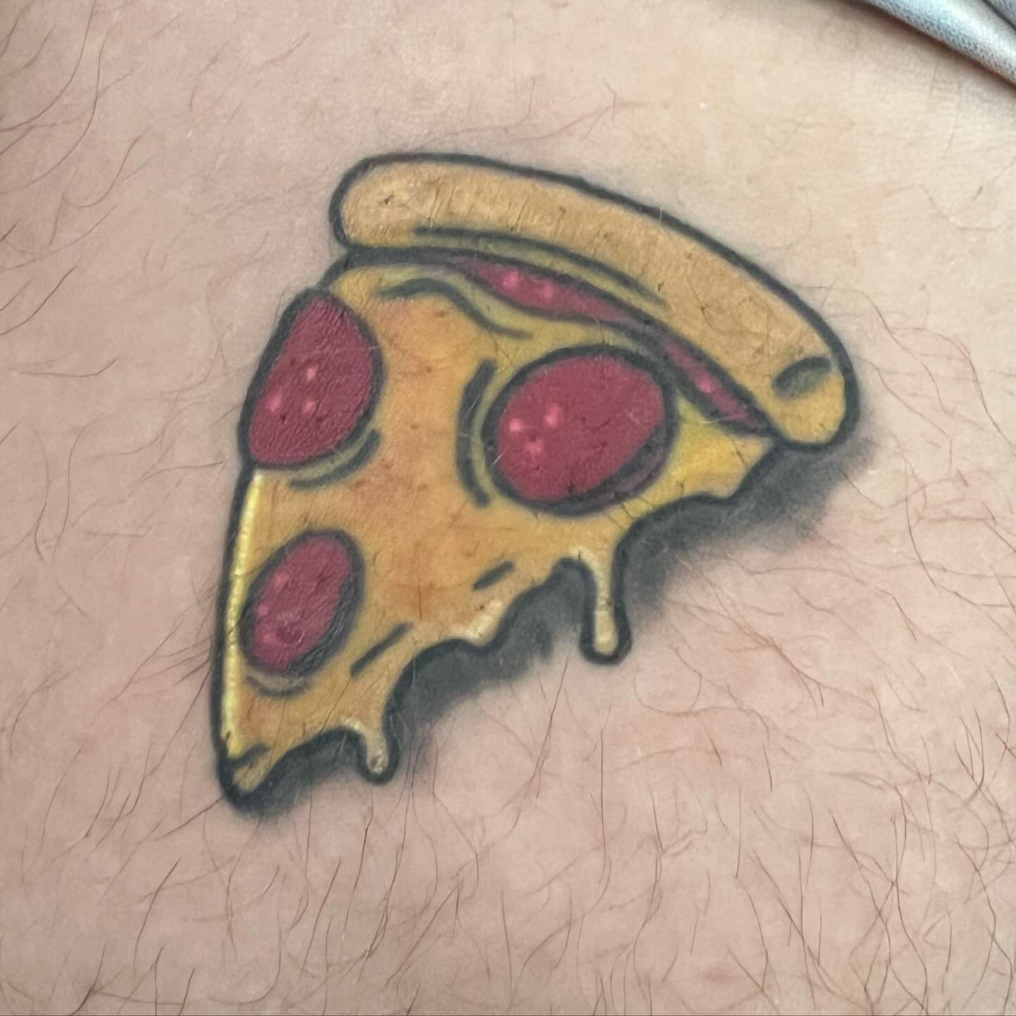 Pizza slice American traditional tattoo on the thigh by Kai