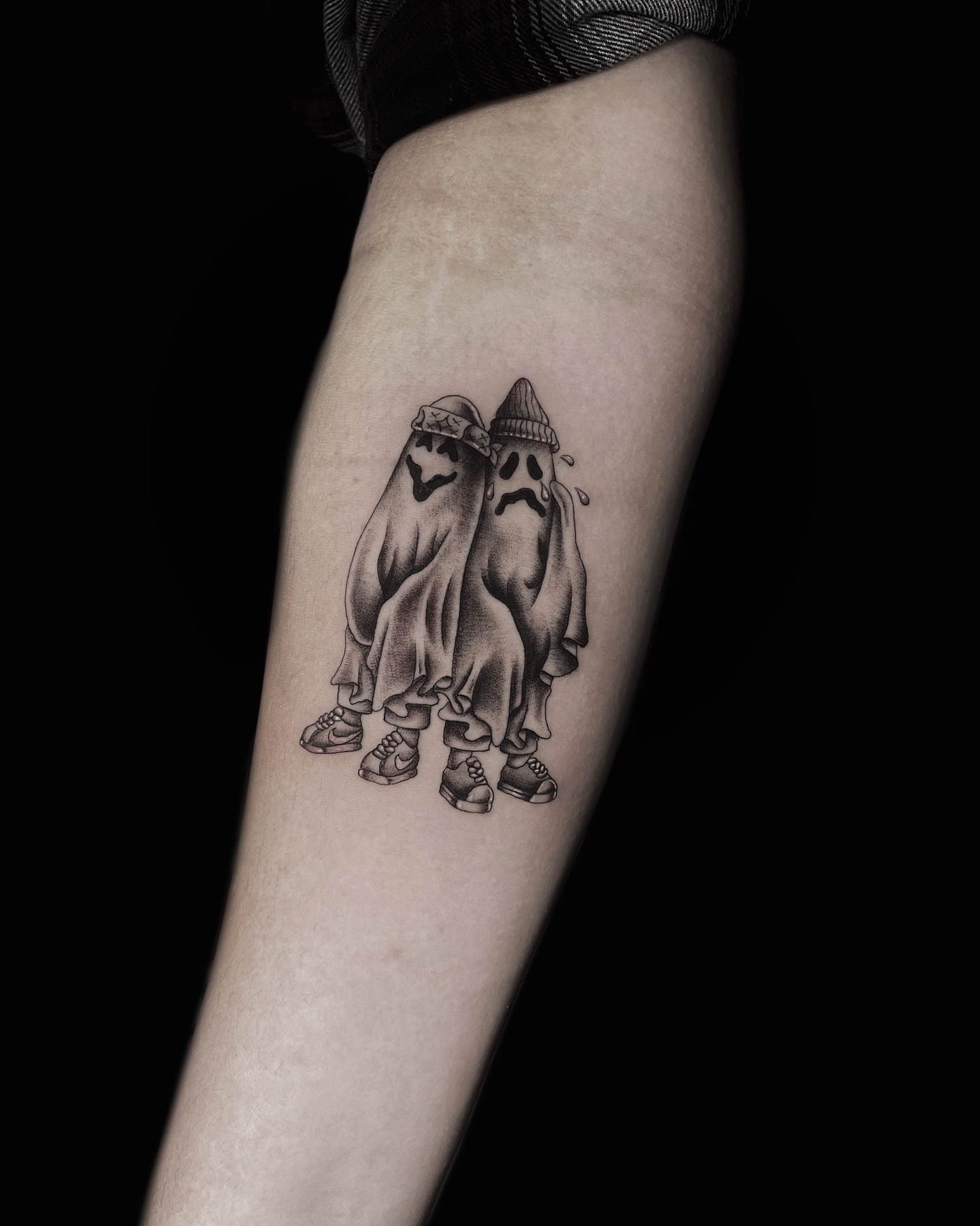 Ghosts black and grey tattoo on the forearm by Jason