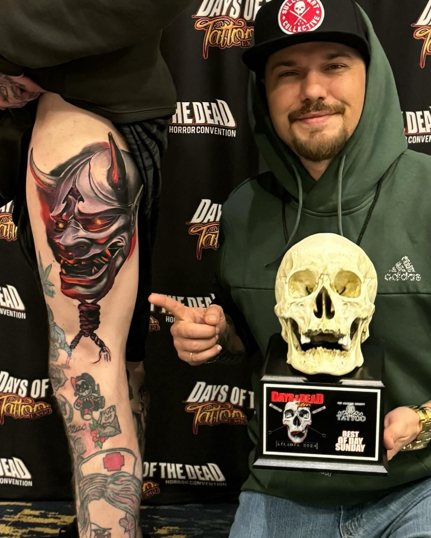 Demon mask dark realism tattoo on the upper arm by Zach Ashton