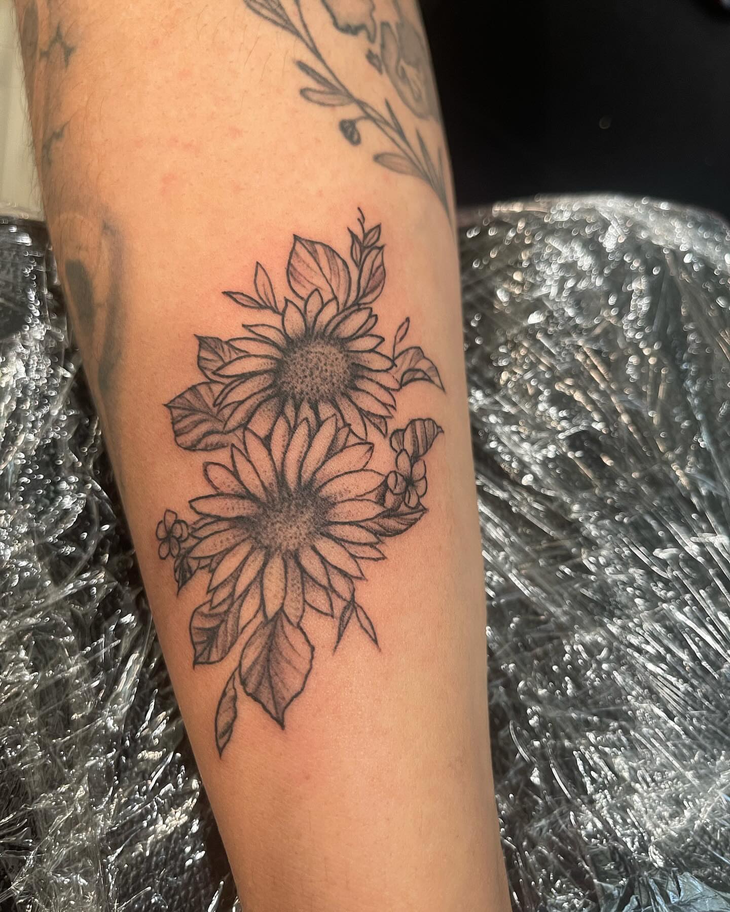 Sunflowers black and grey tattoo on the forearm by Sonia vidal