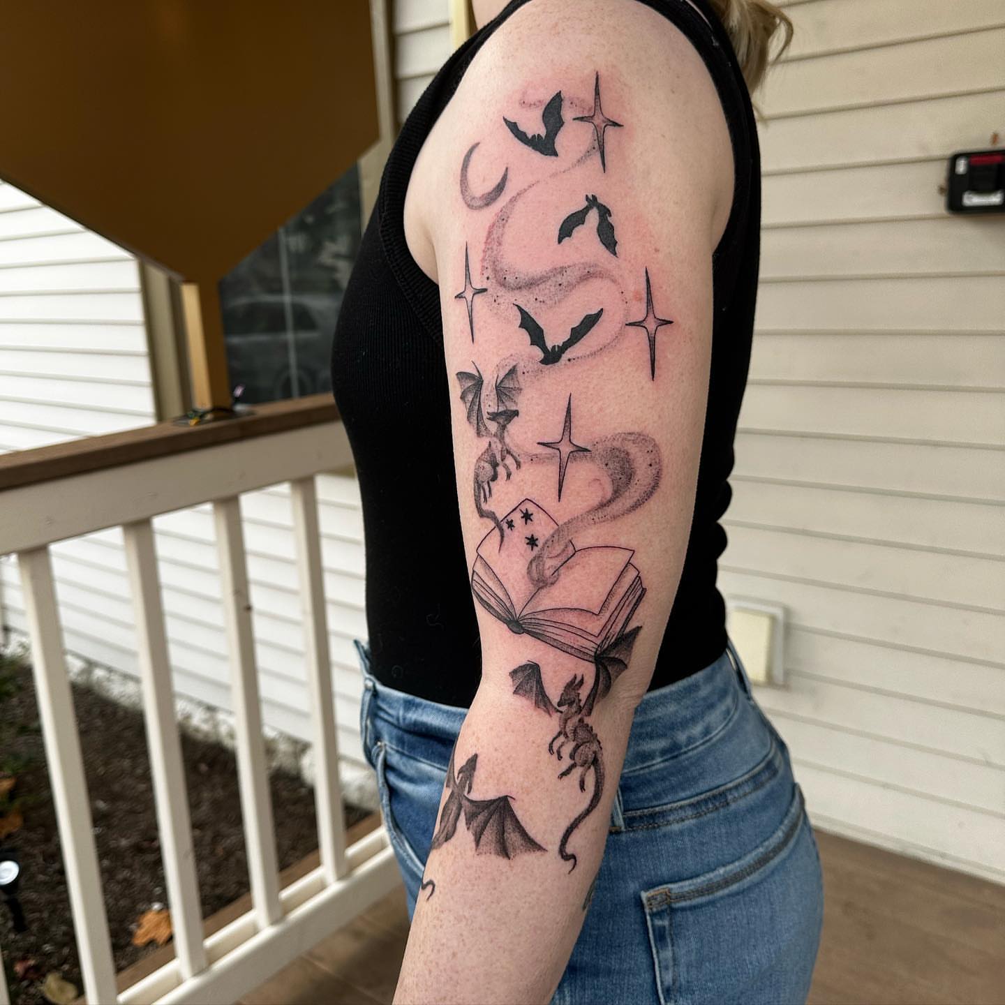 Book and dragon black and grey tattoo on the forearm by manda, Lebanon, Ohio