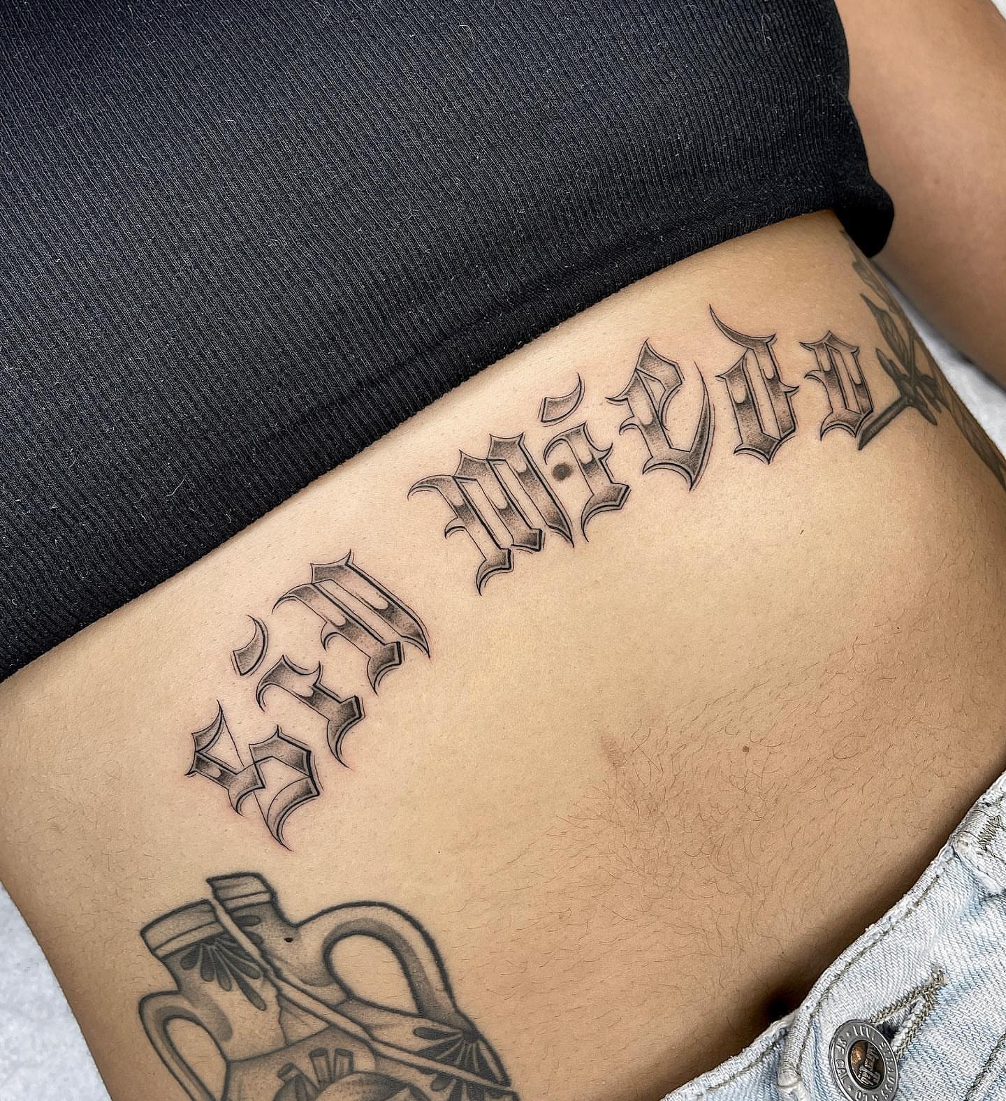 Script lettering lettering script tattoo on the ribs by Tiyanna Garlic