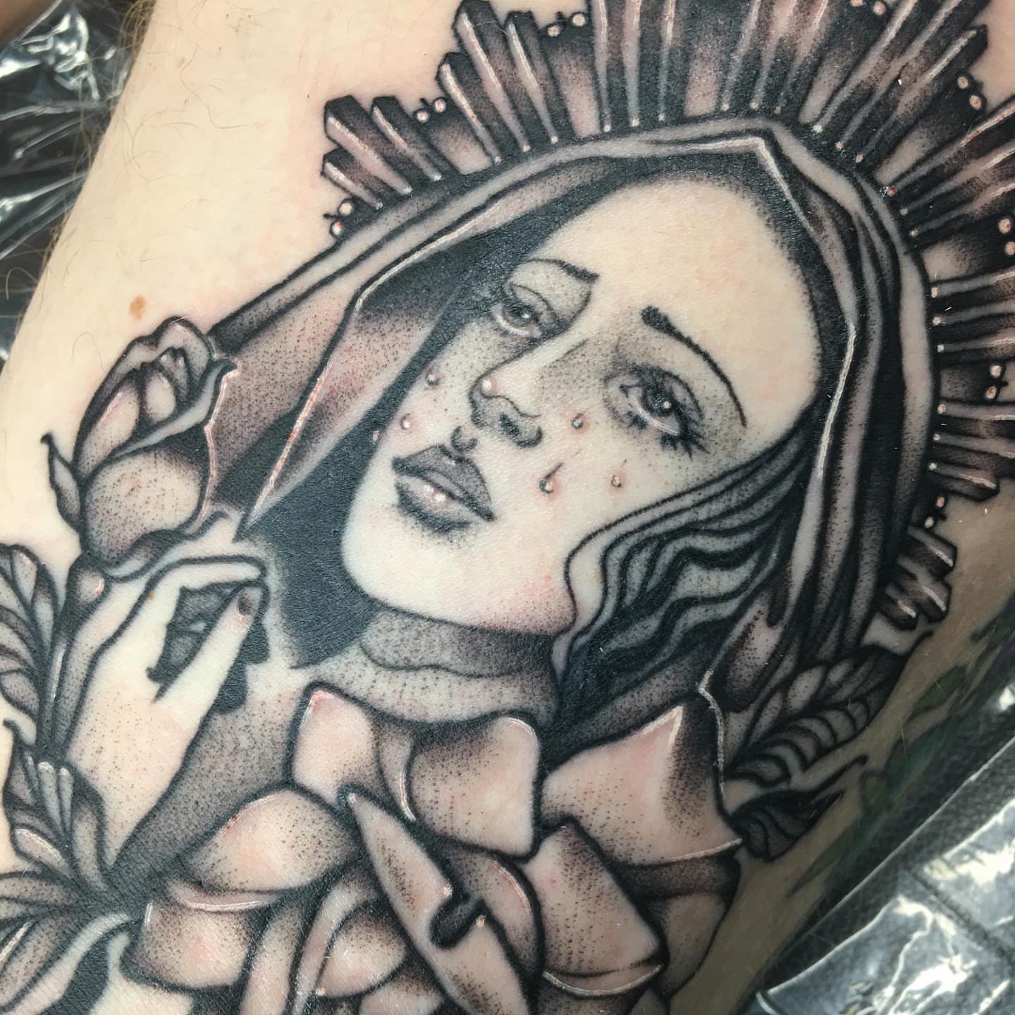 Woman with halo dotwork tattoo on the shoulder by Abbey Martin, Nashville, Tennessee