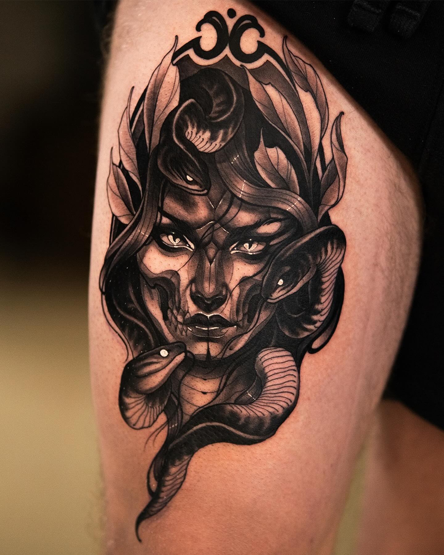 Woman with snakes realism tattoo on the thigh by Anthony Michaels, Tucson, Arizona