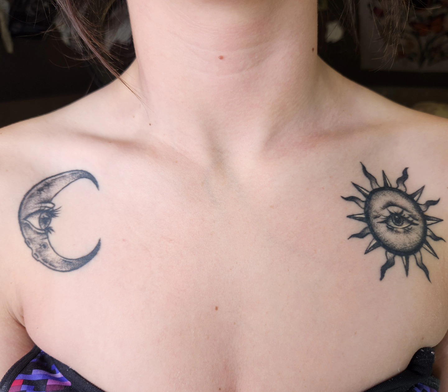 Sun and moon black and grey tattoo on the chest by Audrey Luther