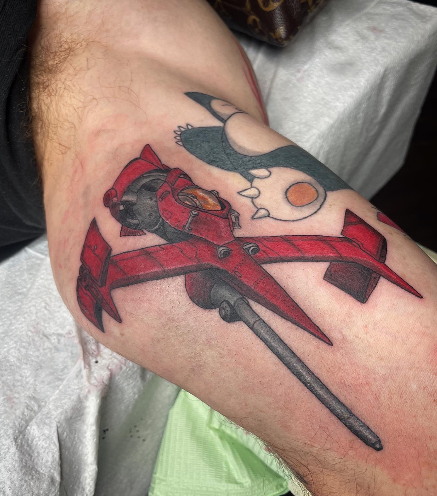 Mecha anime tattoo on the forearm by Alexis Monkiewicz