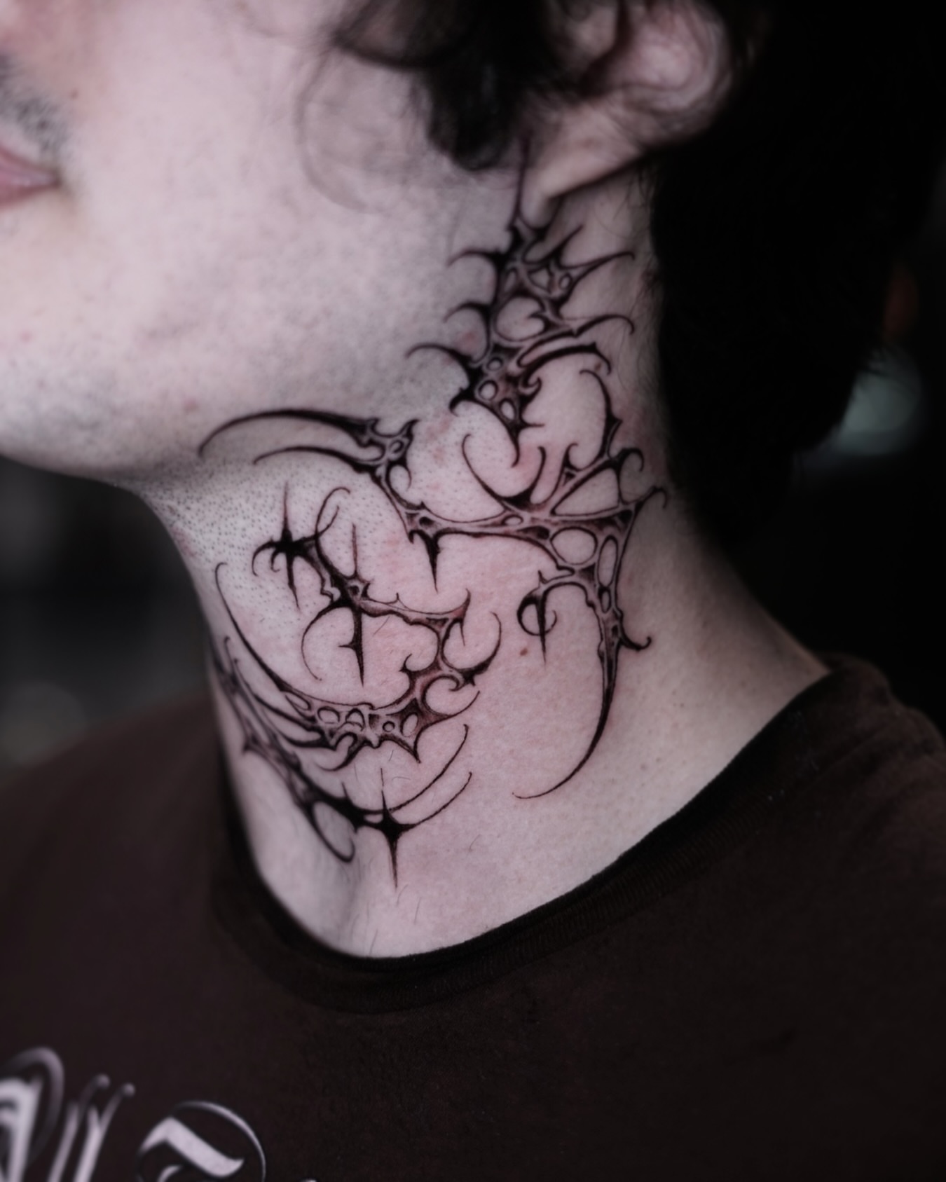 Abstract design black and grey tattoo on the neck by Luisd_art, Charlotte, North Carolina