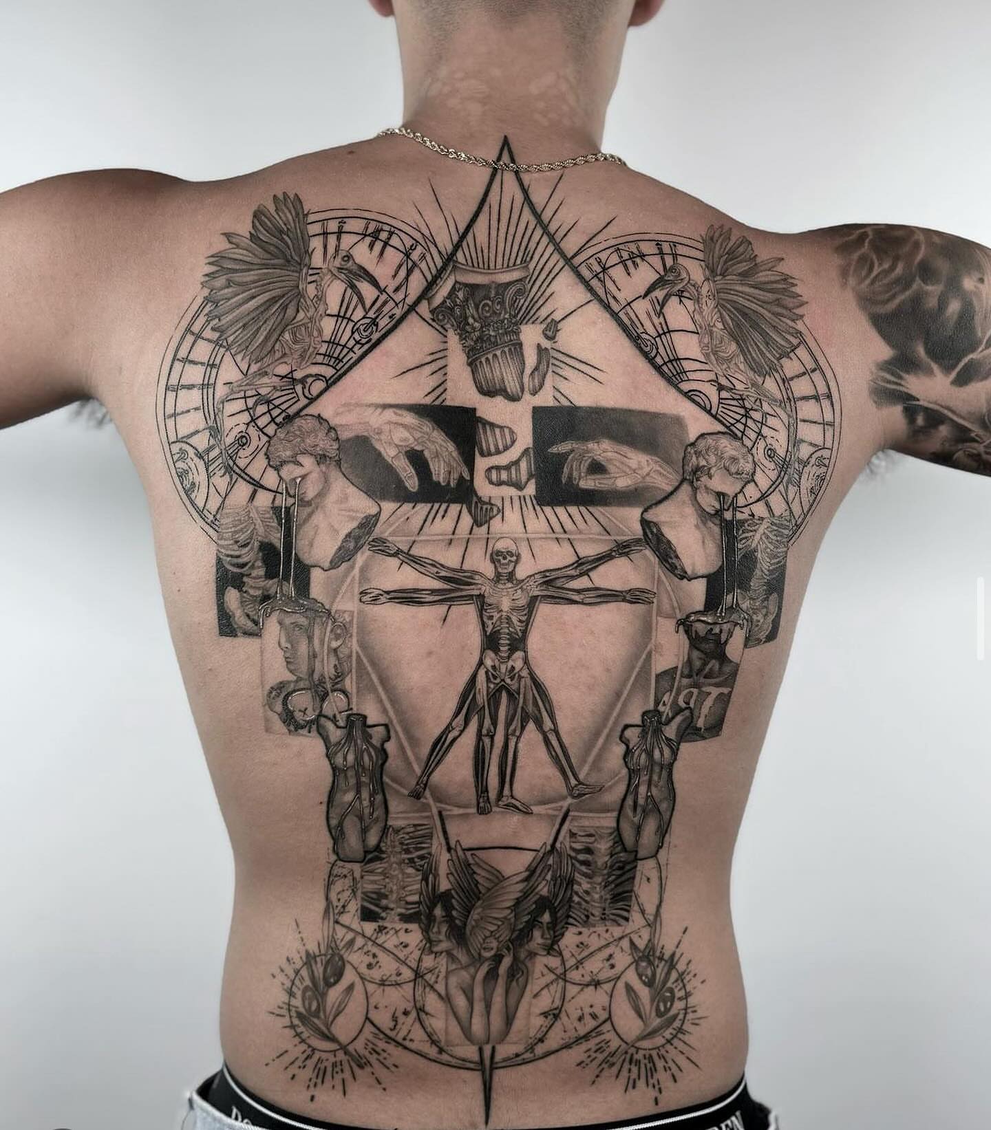 Vitruvian man geometric tattoo on the back by Tiny