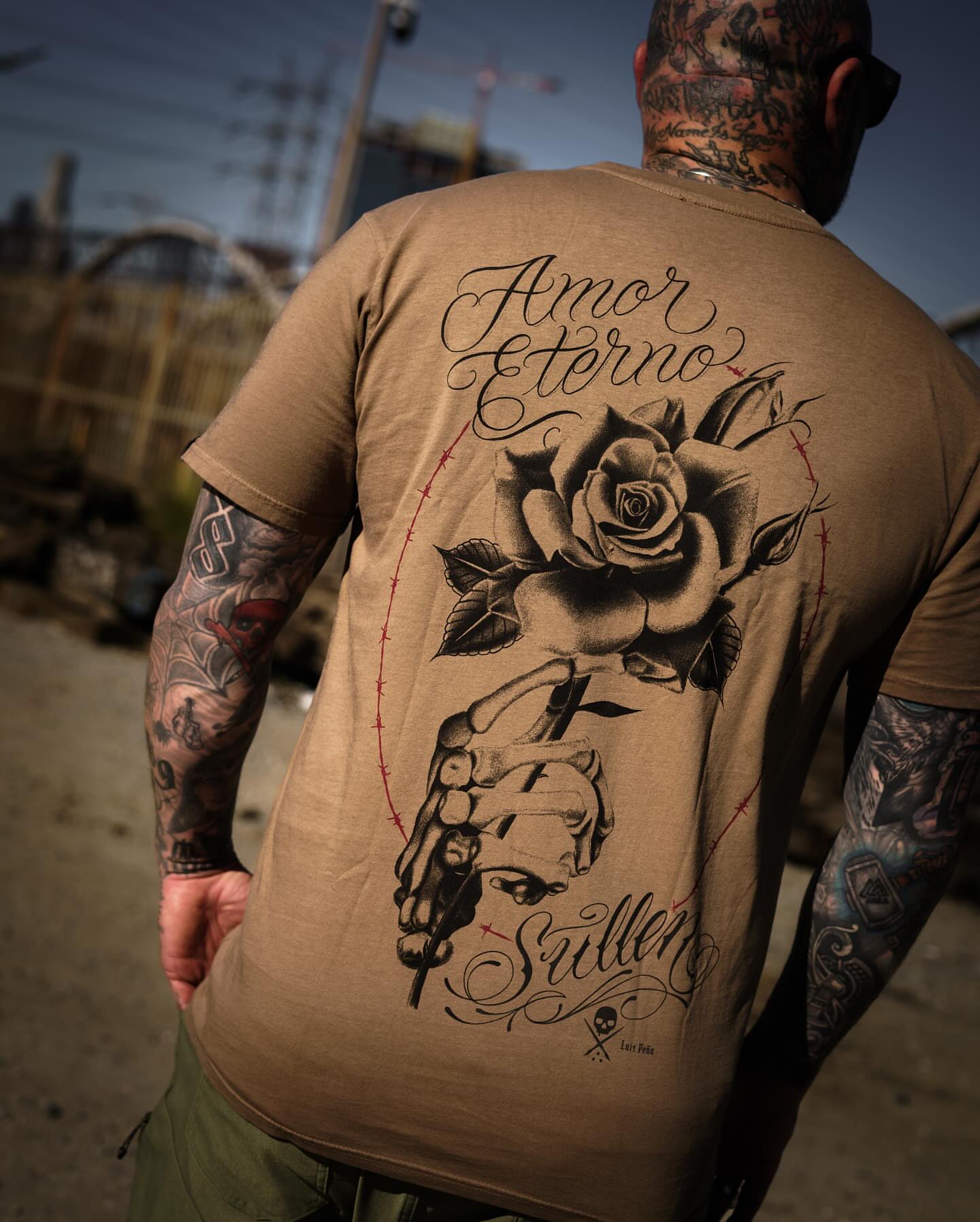 Rose and hand realism tattoo on the back by Luis Peña