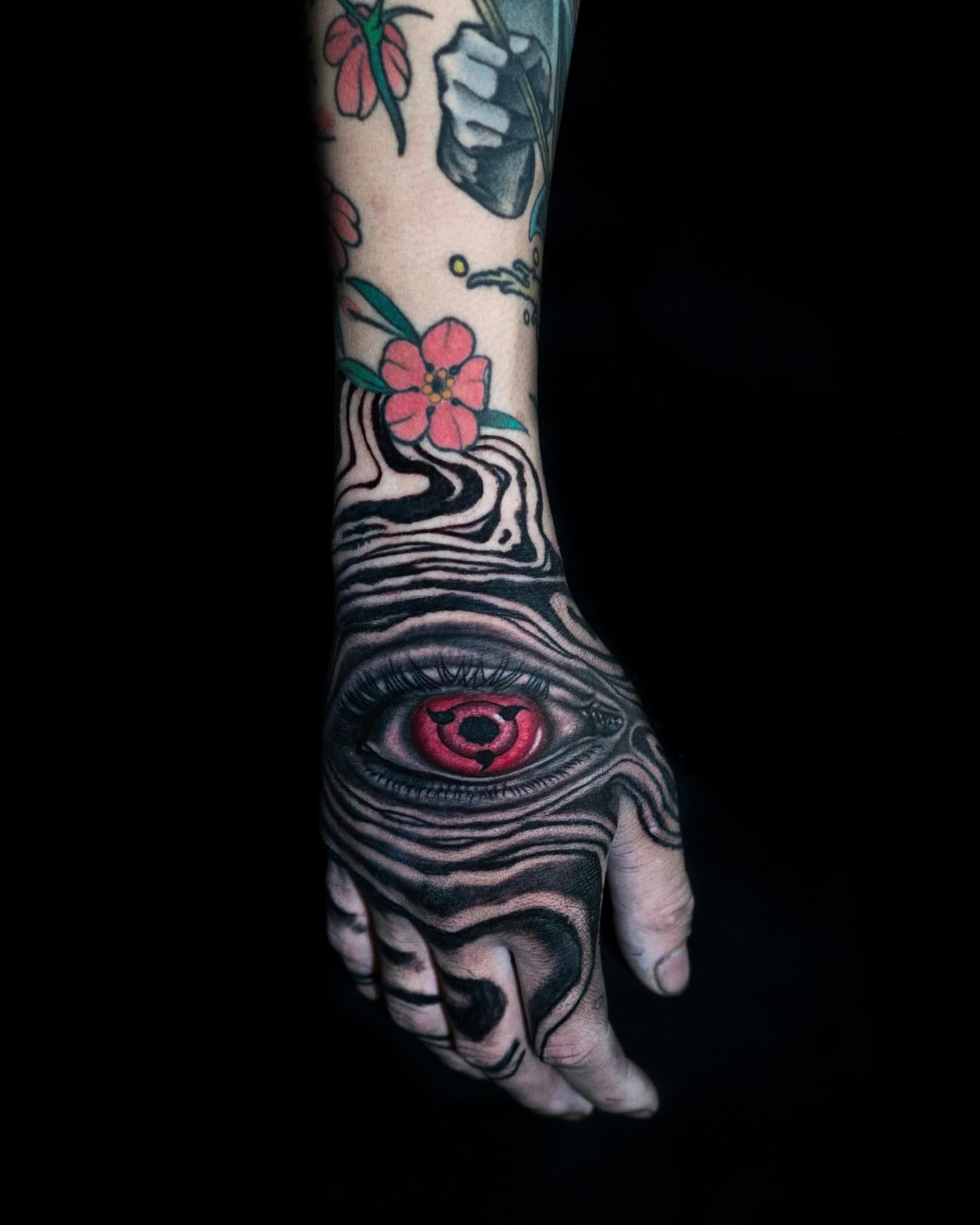 Eye with zebra stripes realism tattoo on the hand by Tattoo Artist