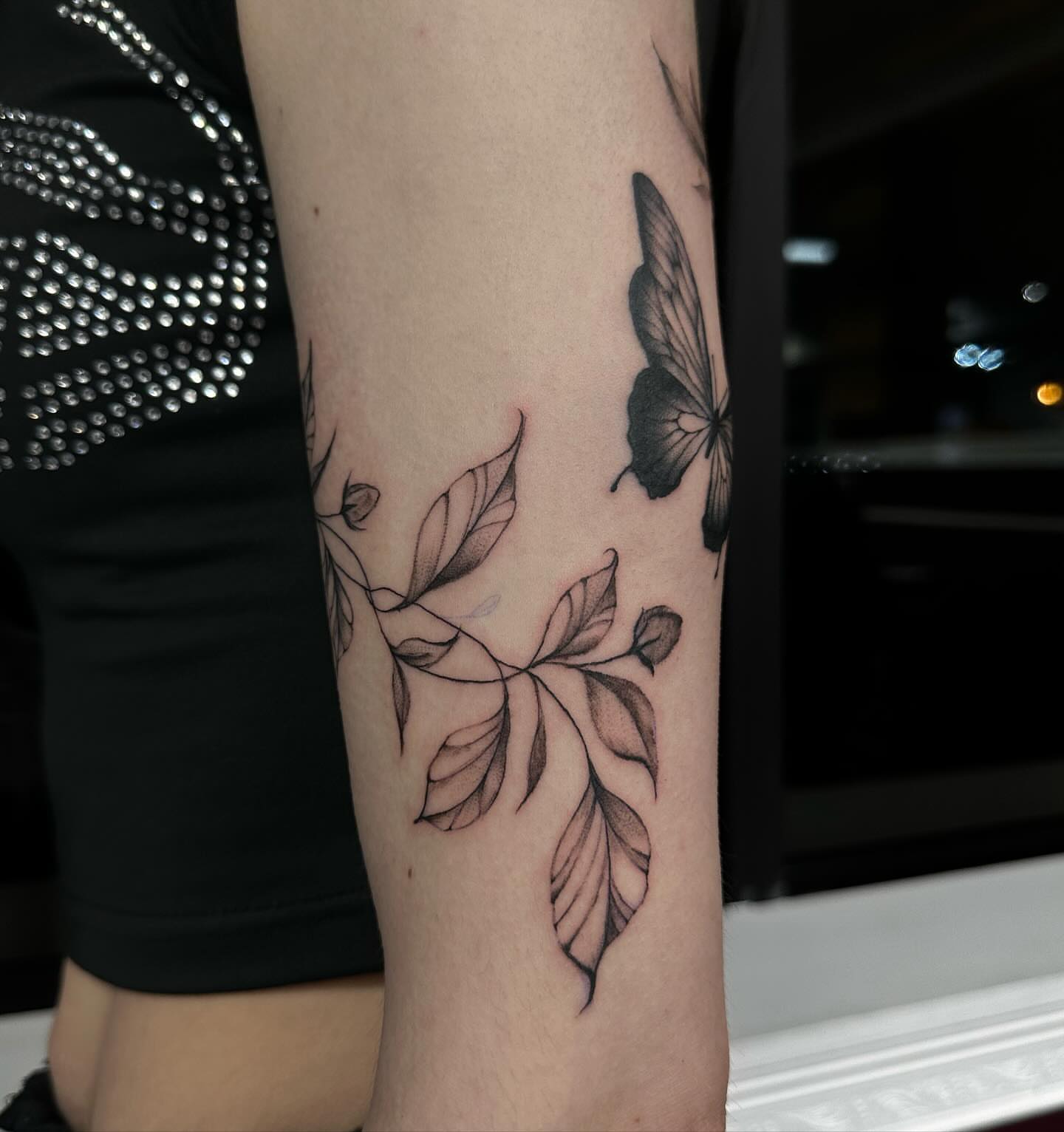 Butterfly and leaves realism tattoo on the forearm by chloe🗡️🖤🦇🩸