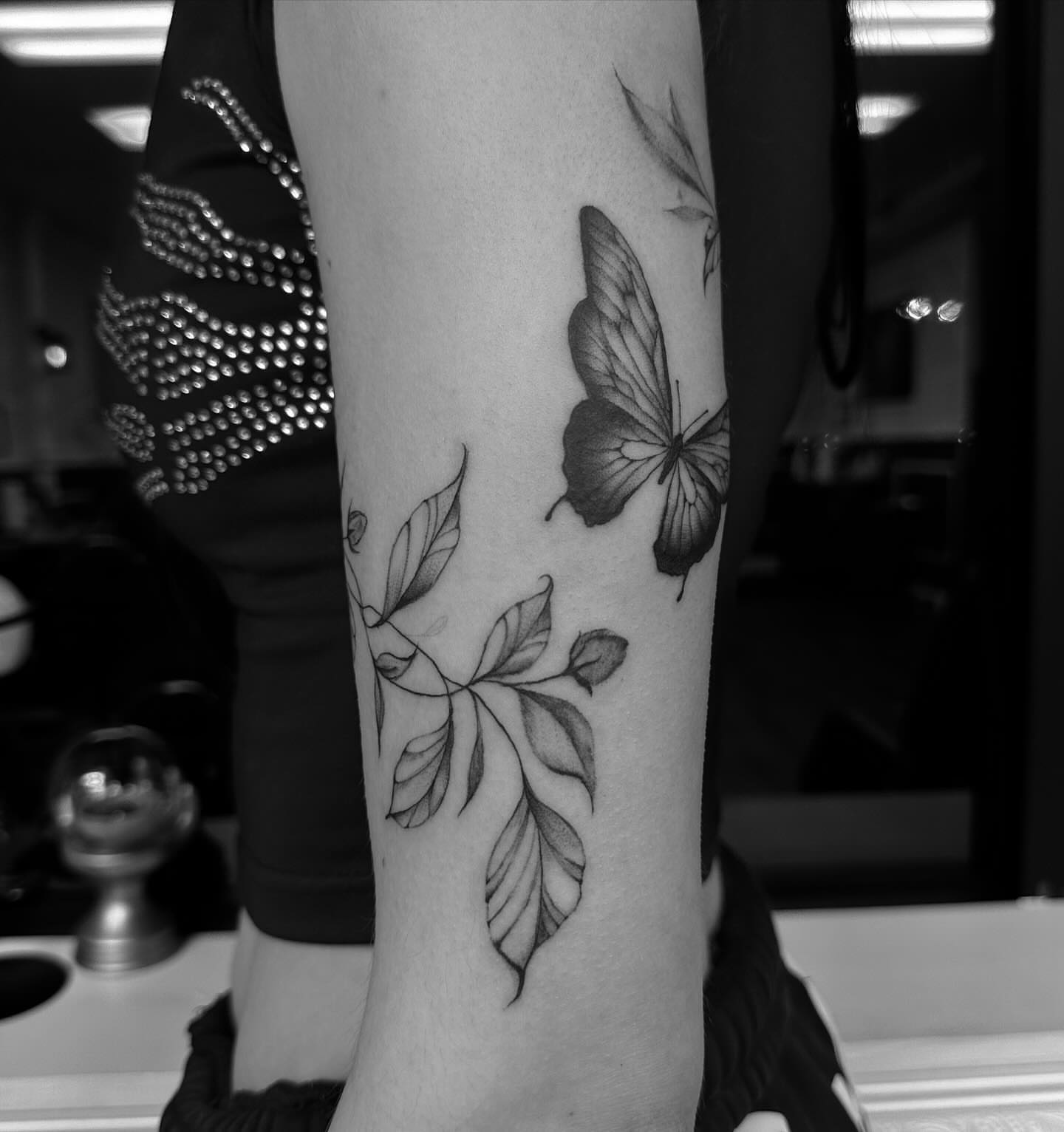 Butterfly and leaves realism tattoo on the forearm by chloe🗡️🖤🦇🩸