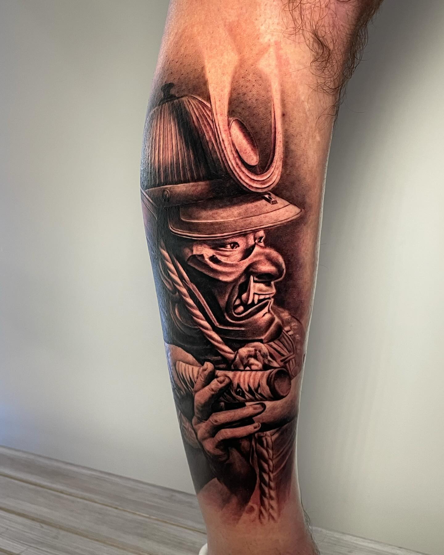 Firefighter helmet realism tattoo on the forearm by Justin Reid, San Jose, California