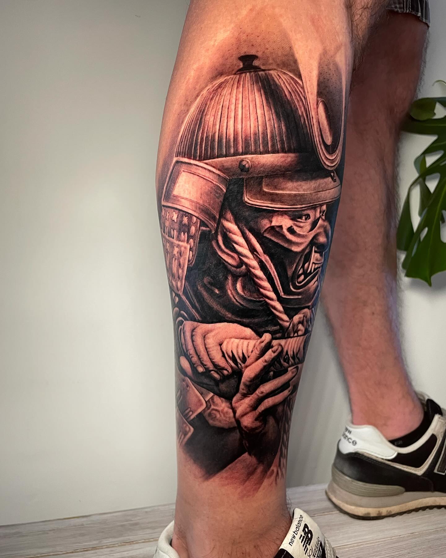 Warrior helmet realism tattoo on the calf by Justin Reid, San Jose, California