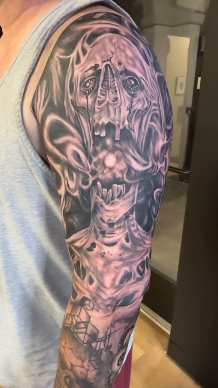 Skull and abstract elements dark realism tattoo by Pablo Venegas