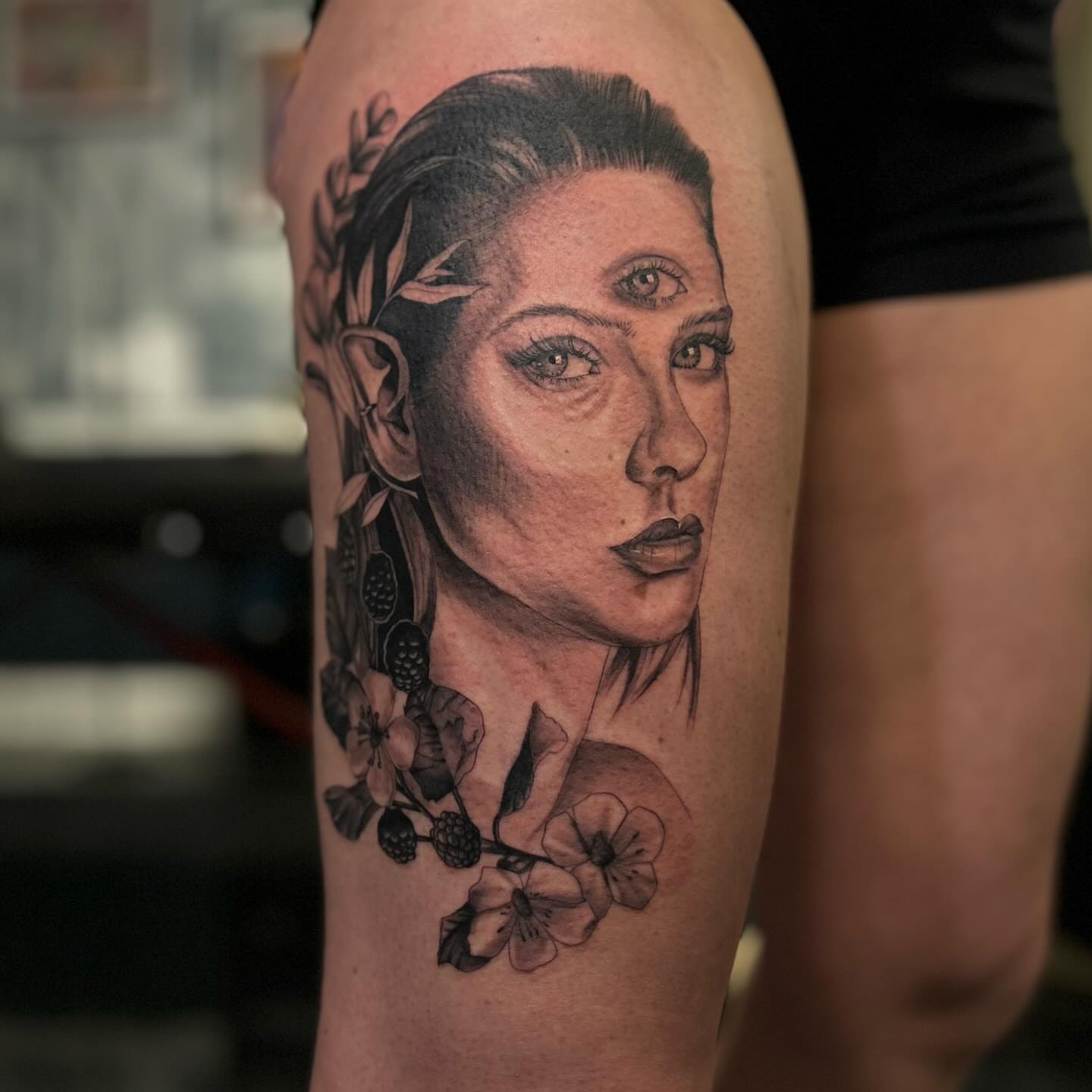 Woman's portrait realism tattoo on the thigh by Jaiden Ducoff
