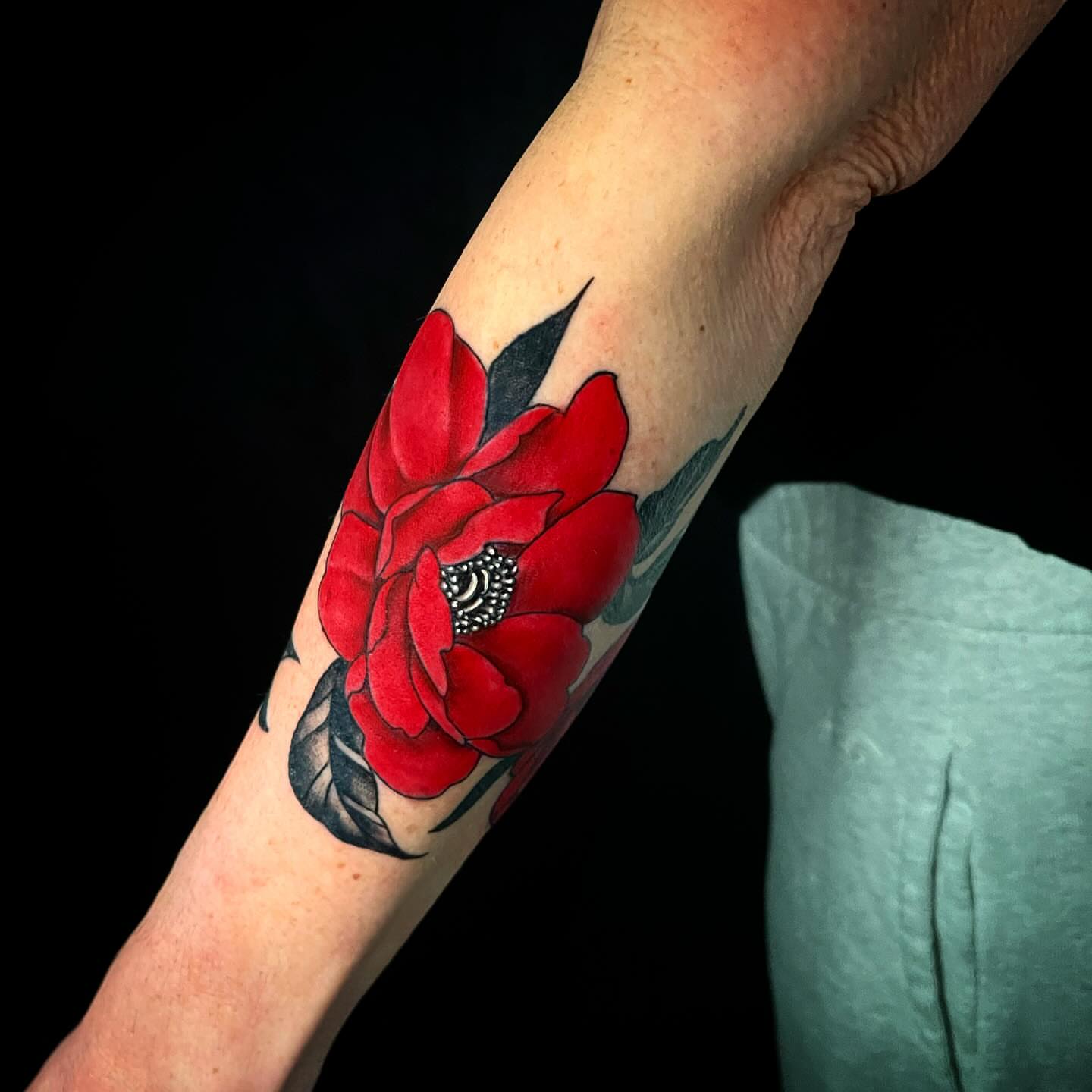 Red roses realism tattoo on the forearm by 𝓚𝓪𝓼𝓼𝓪𝓷𝓭𝓻𝓪 𝓜𝓬𝓒𝓪𝓵𝓵, Eugene, Oregon
