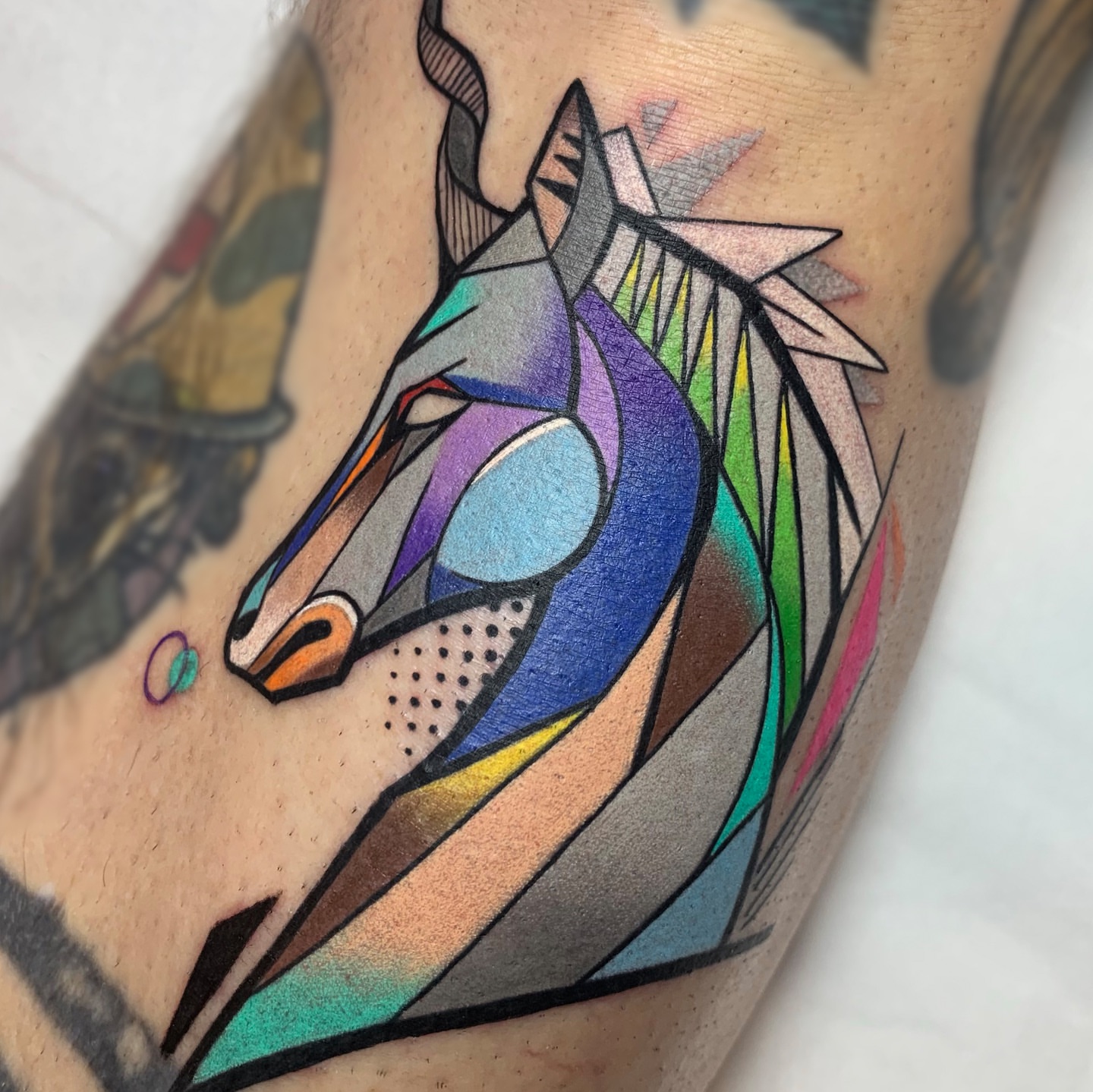Geometric horse head geometric tattoo on the forearm by hurjaesae
