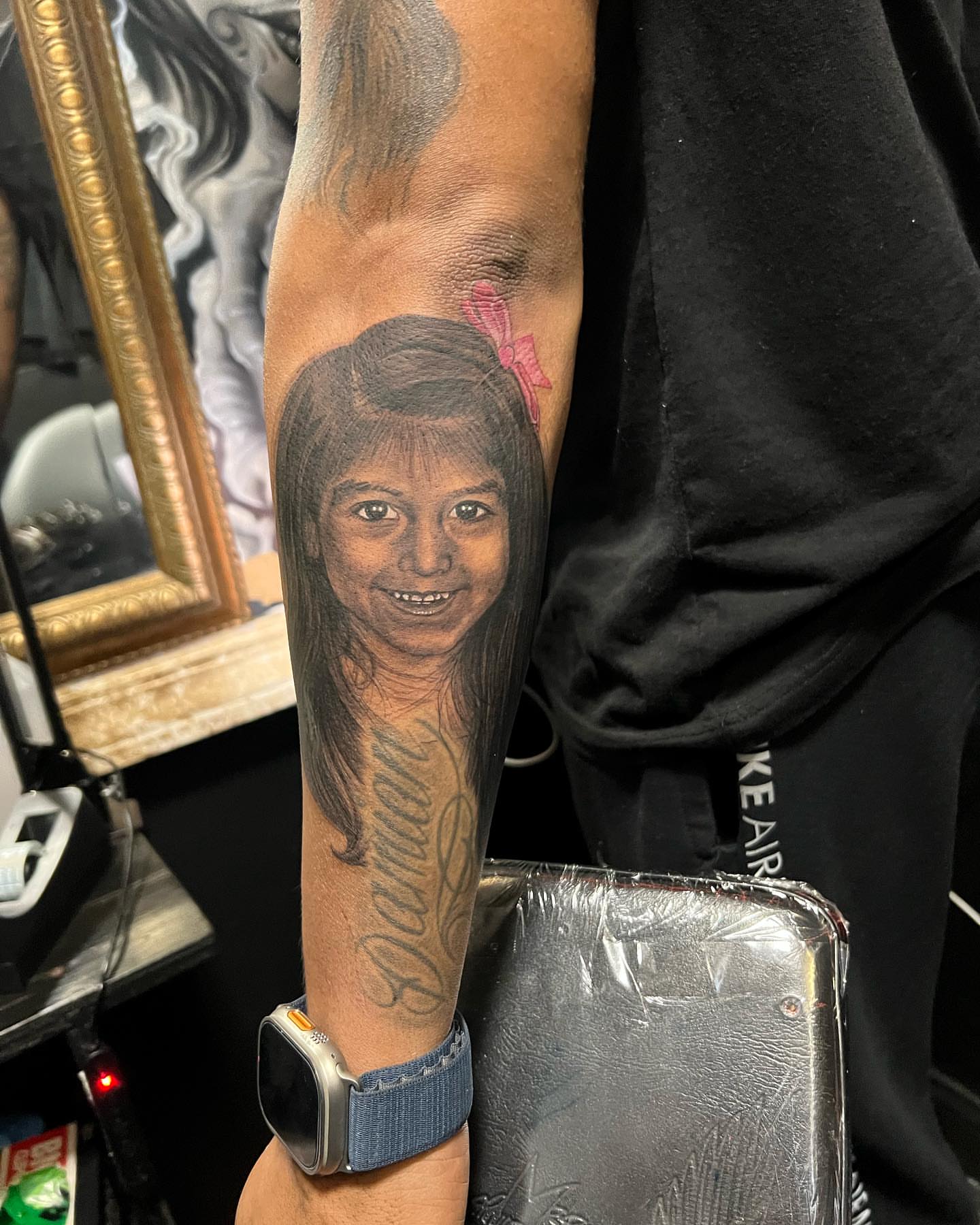 Portrait of a child realism tattoo on the forearm by JT Ink