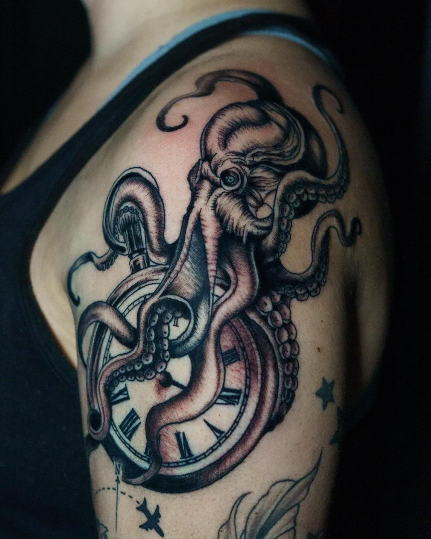 Octopus and clock neo-traditional tattoo on the shoulder by Nate Masi