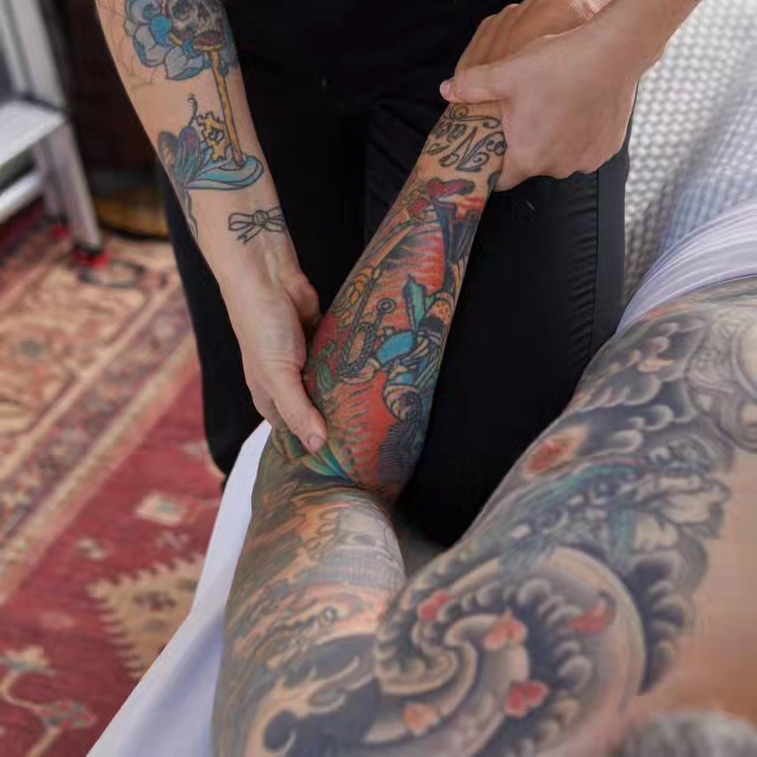 Military-themed sleeve American traditional tattoo on the upper arm by Mark Harada, Hoboken, New Jersey