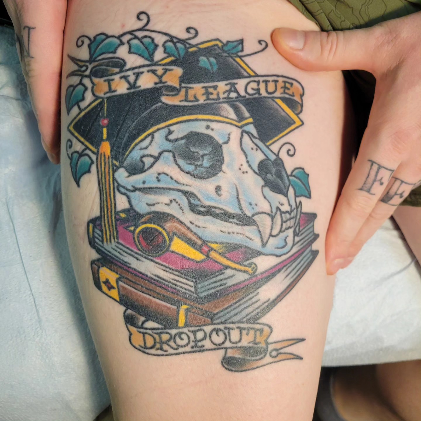 Ivy league dropout American traditional tattoo on the thigh by Mark Harada, Hoboken, New Jersey