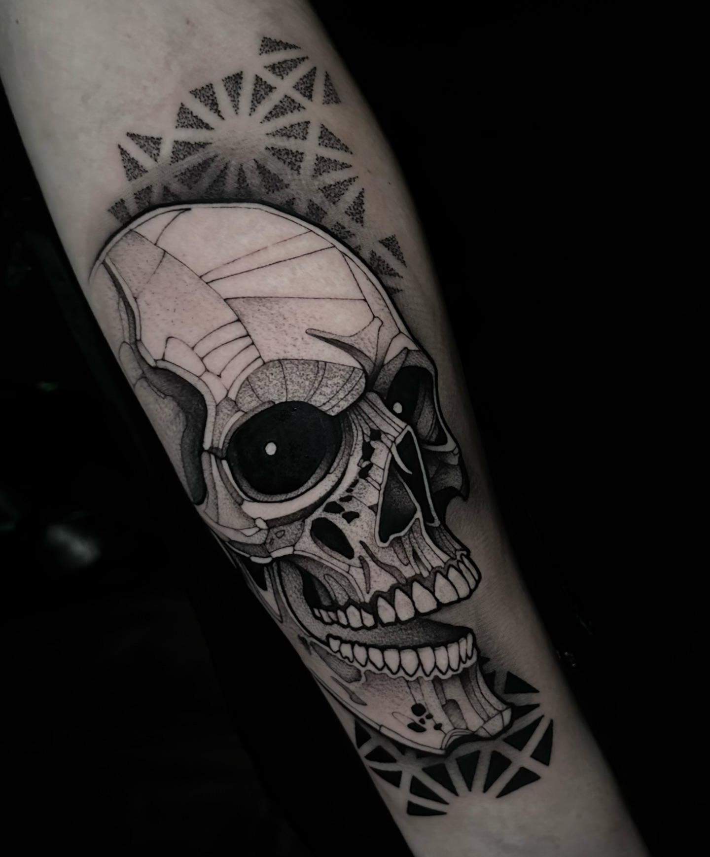 Skull realism tattoo on the forearm by Clayton Smith (BEAR)