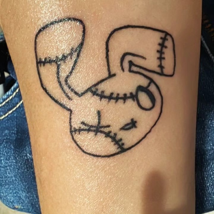 Stuffed animal black and grey tattoo on the forearm by Lopez Dautruche